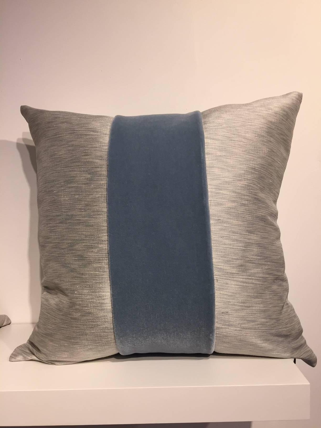 One pair cushions, Jacquard fabric silk colour oyster and ice blue with centre stripe in Mohair col. Ice blue on front and back, size 50 x 50cm, concealed zipper in the bottom seam, inner pad with feather