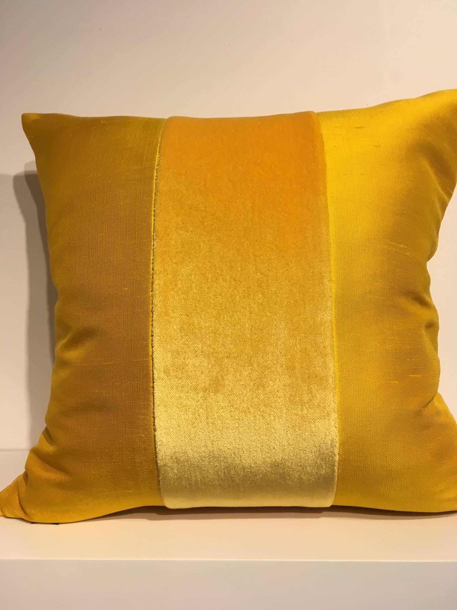 One pair cushions, Jacquard fabric silk colour sun yellow with centre stripe in Mohair colour Sun yellow on front and back, size 50 x 50cm, concealed zipper in the bottom seam, inner pad with feather