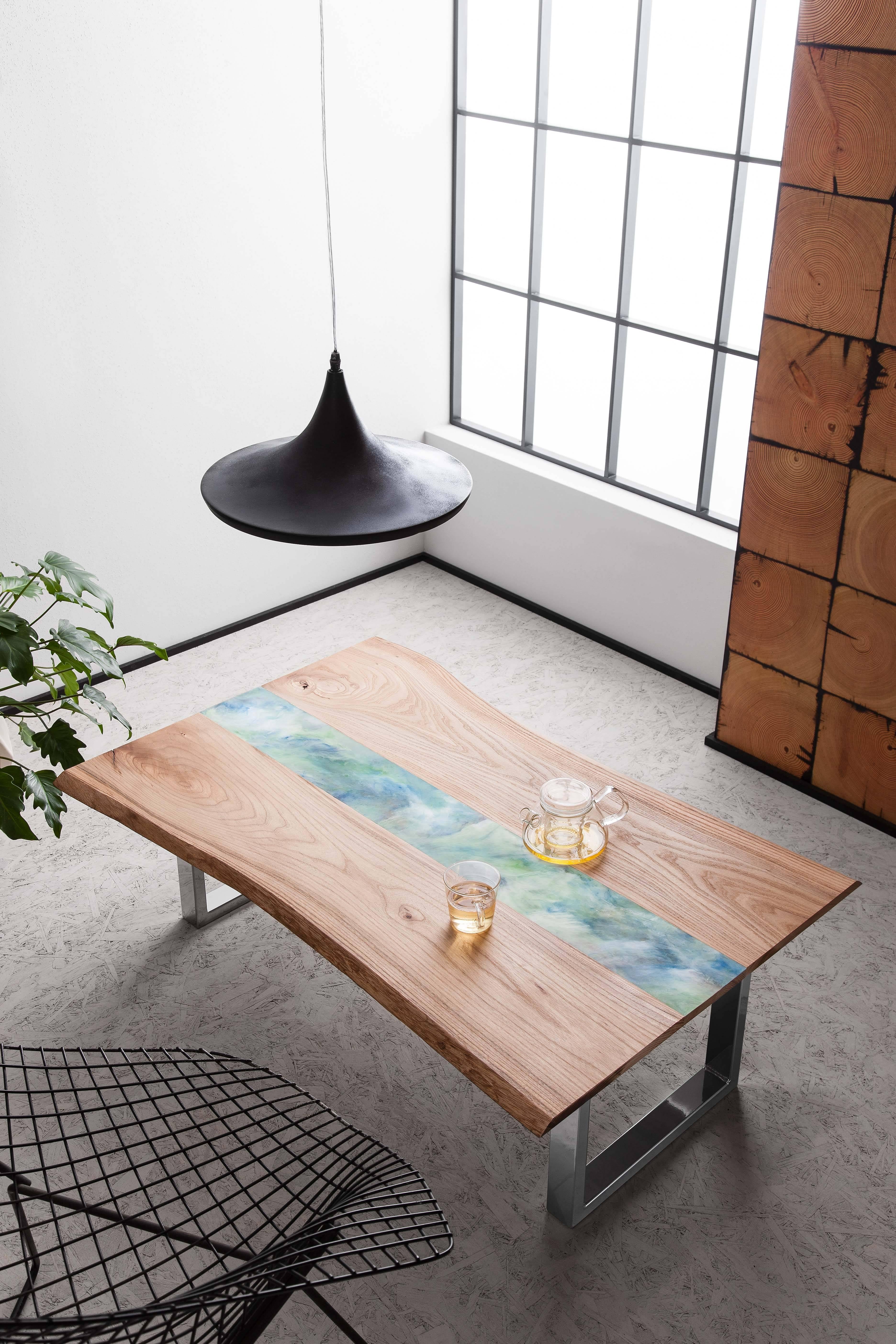 New for 2017, the resin art tables fuse natural live edge boards with flowing lines of hand poured resin art. 
Sustainably sourced live edge English Elm (which can be traced to the individual tree) is paired with resin inlay in a variety of colours,