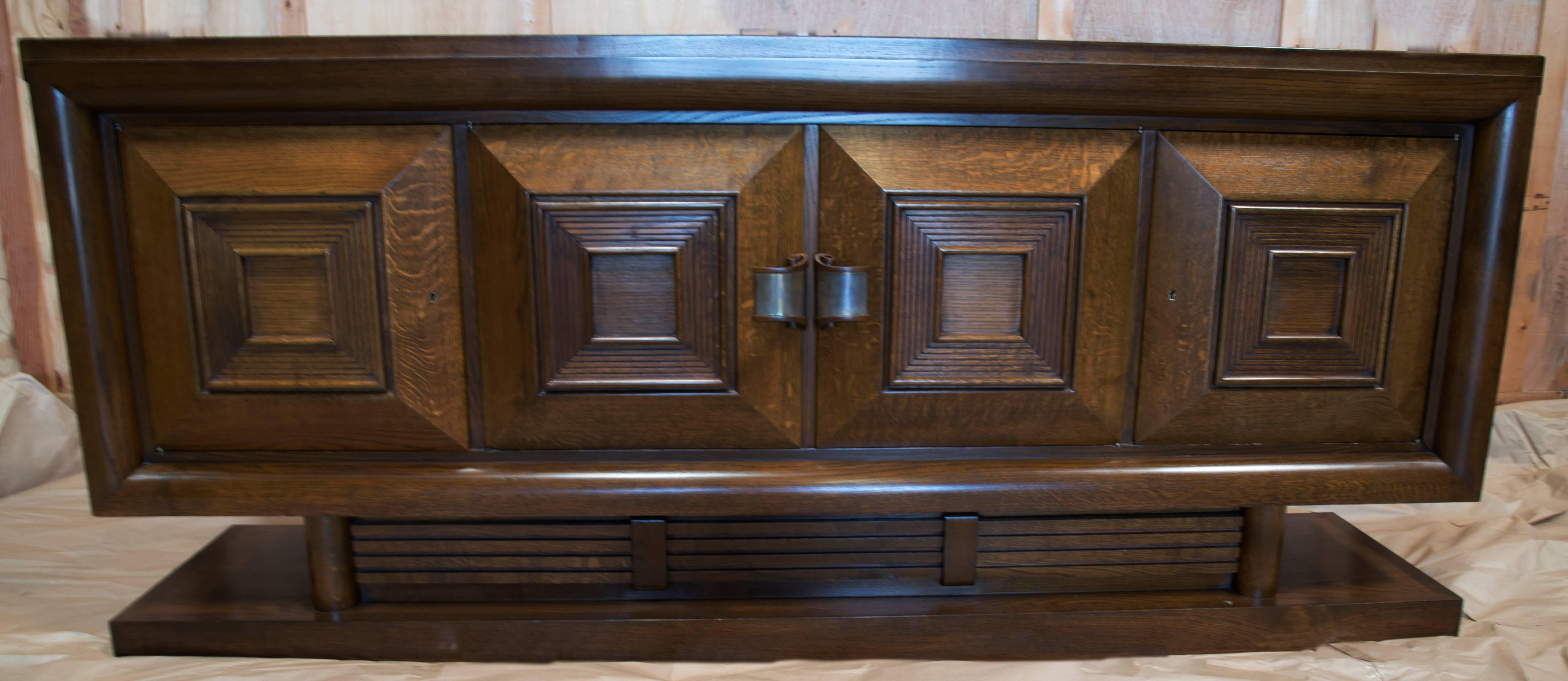 Solid perused oak buffet designed by CHARLES DUDOUYT, a famous French decorator [1885 - 1946]. This piece is part of his last designs. The amazing case piece comes with two cabinet doors that open to the interior of the cabinetry,  circa 1946. This