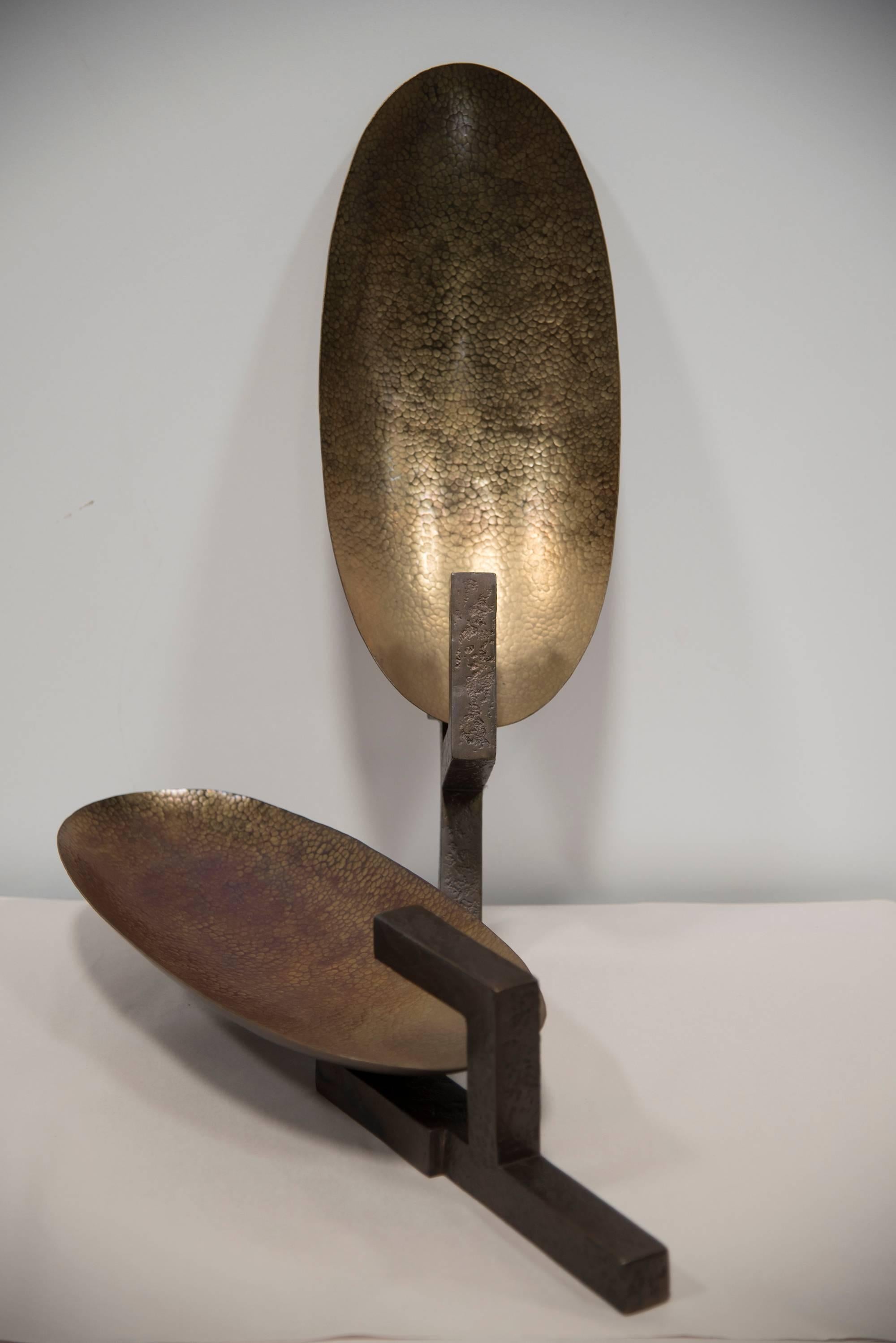 A pair of contemporary bronze scones designed by Herve Van Der Straeten, France, circa 2004.