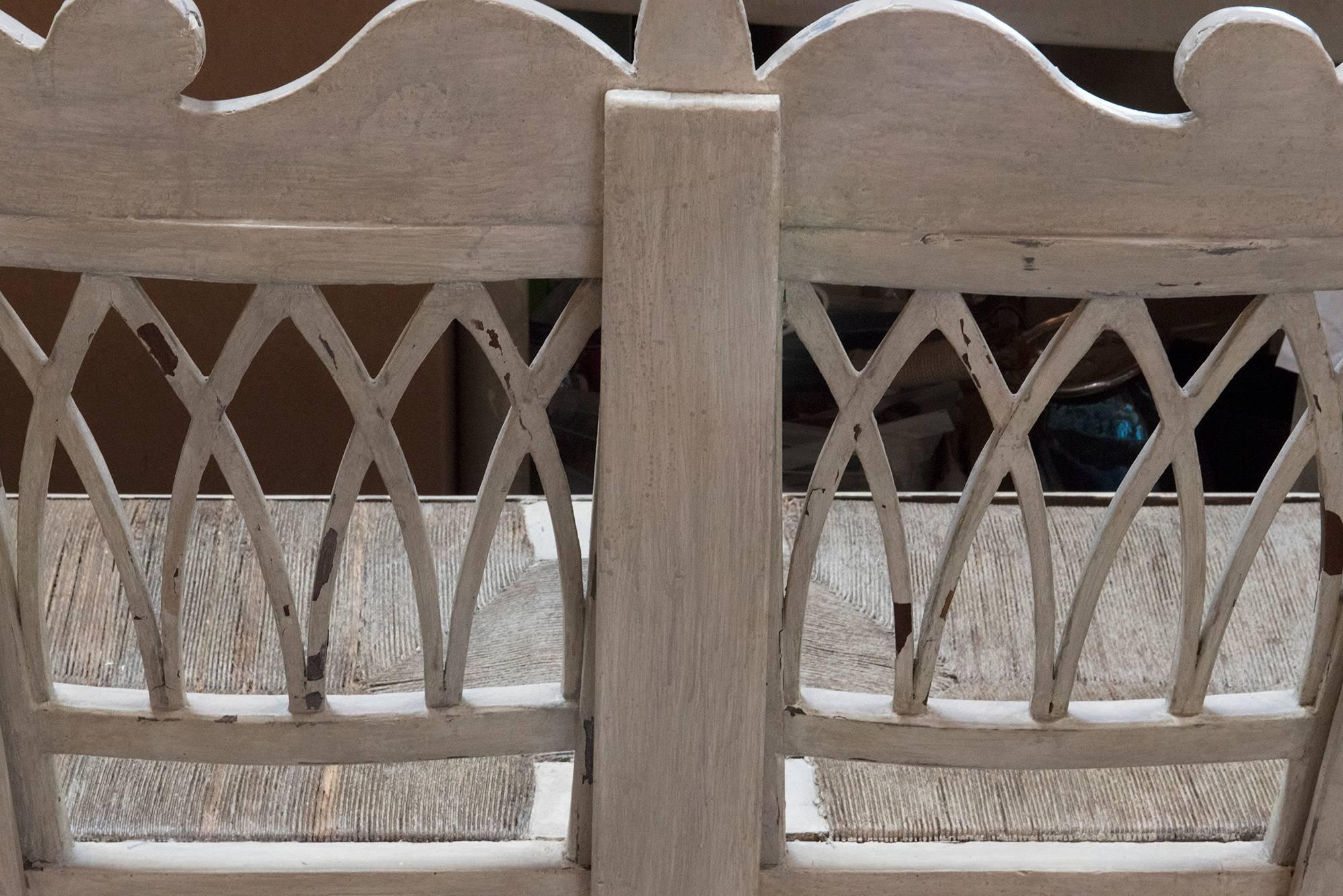 A beautiful, and in fabulous condition, carved Gustavian bench with woven seating in perfect condition [no tears or rips here!], with Swan design on the arm rests. Sculpted back and solid frame make this an exceptional piece for your collection.