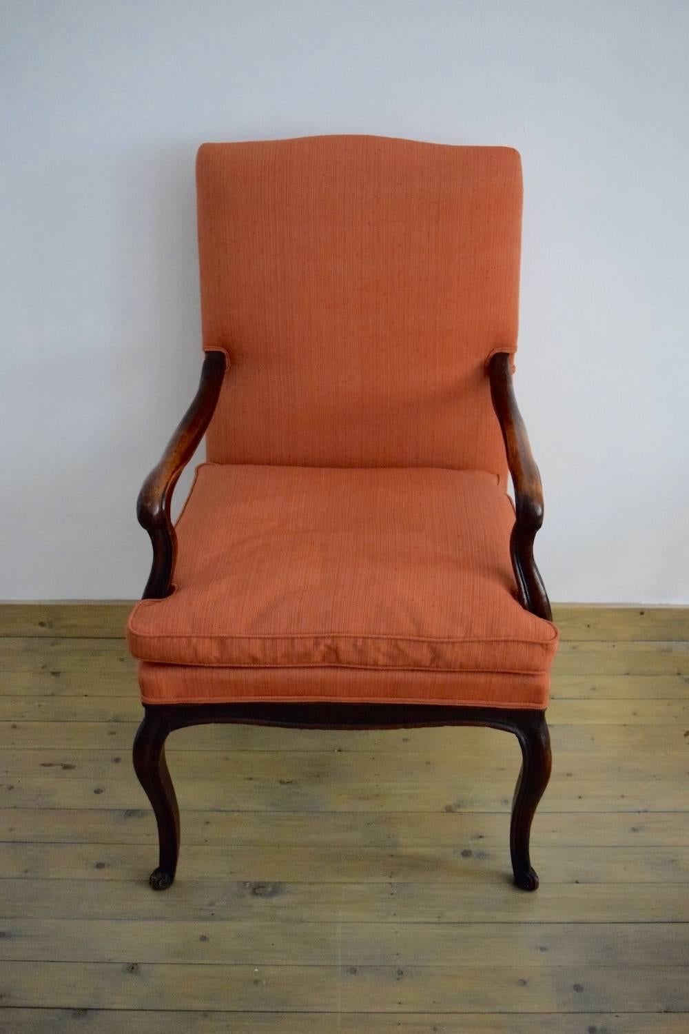 French, polished dark burr wood armchair upholstered in pale-red linen,
early to mid-18th century.