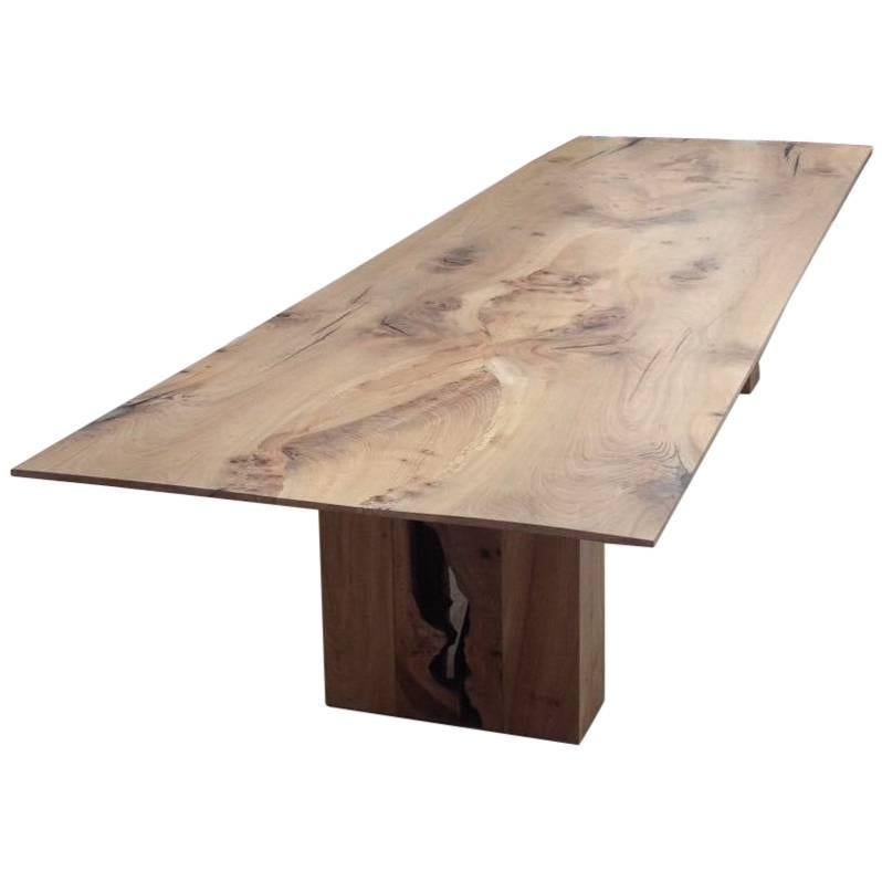 Contemporary solid English elm dining table, book matched with a taper edge, 