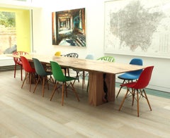 Contemporary solid English elm dining table, book matched with a taper edge,
