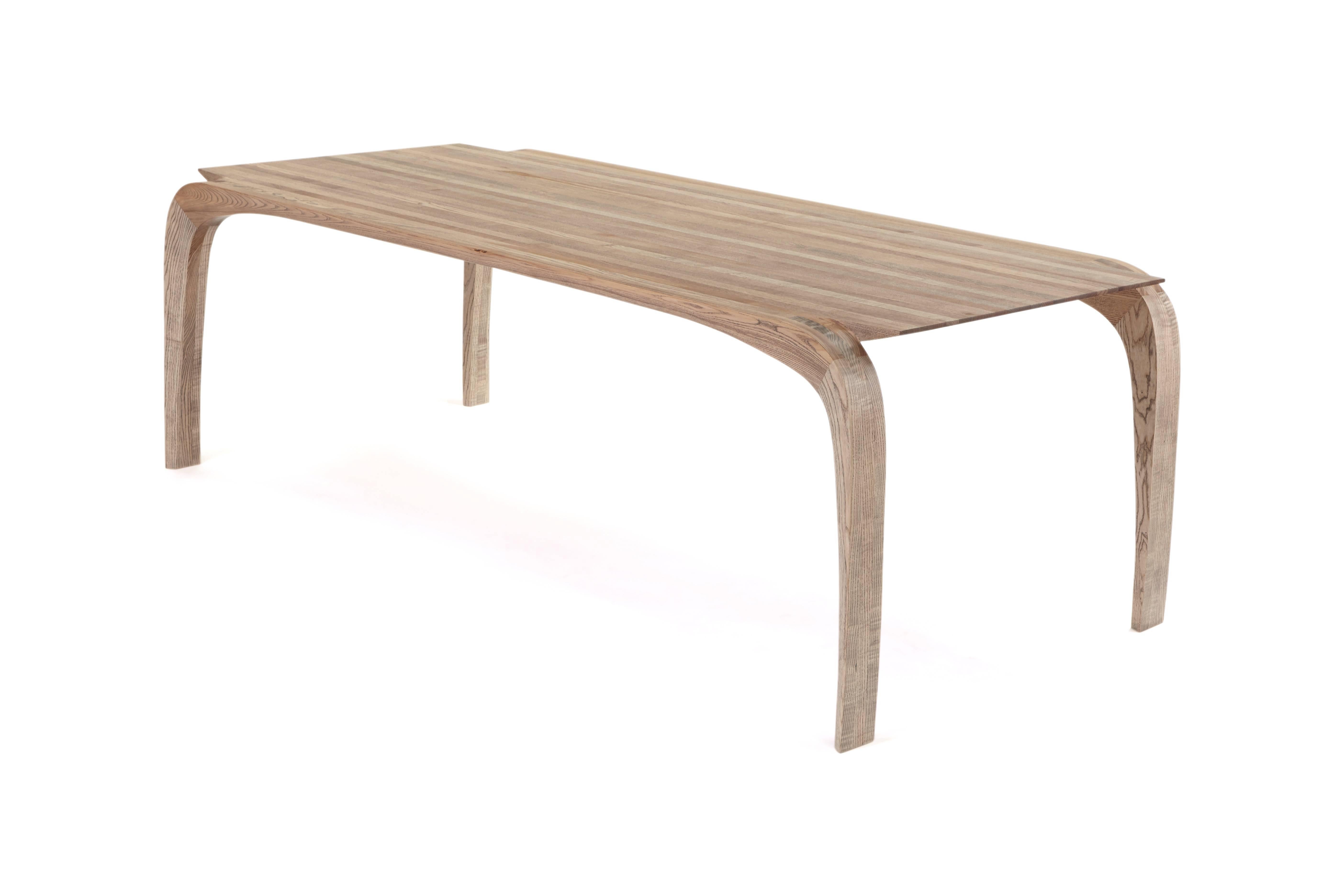 Modern Contemporary bespoke ash dining table. hand shaped legs by Jonathan Field.