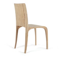 Award winning rippled, ash hand-carved chairs. by Jonathan Field