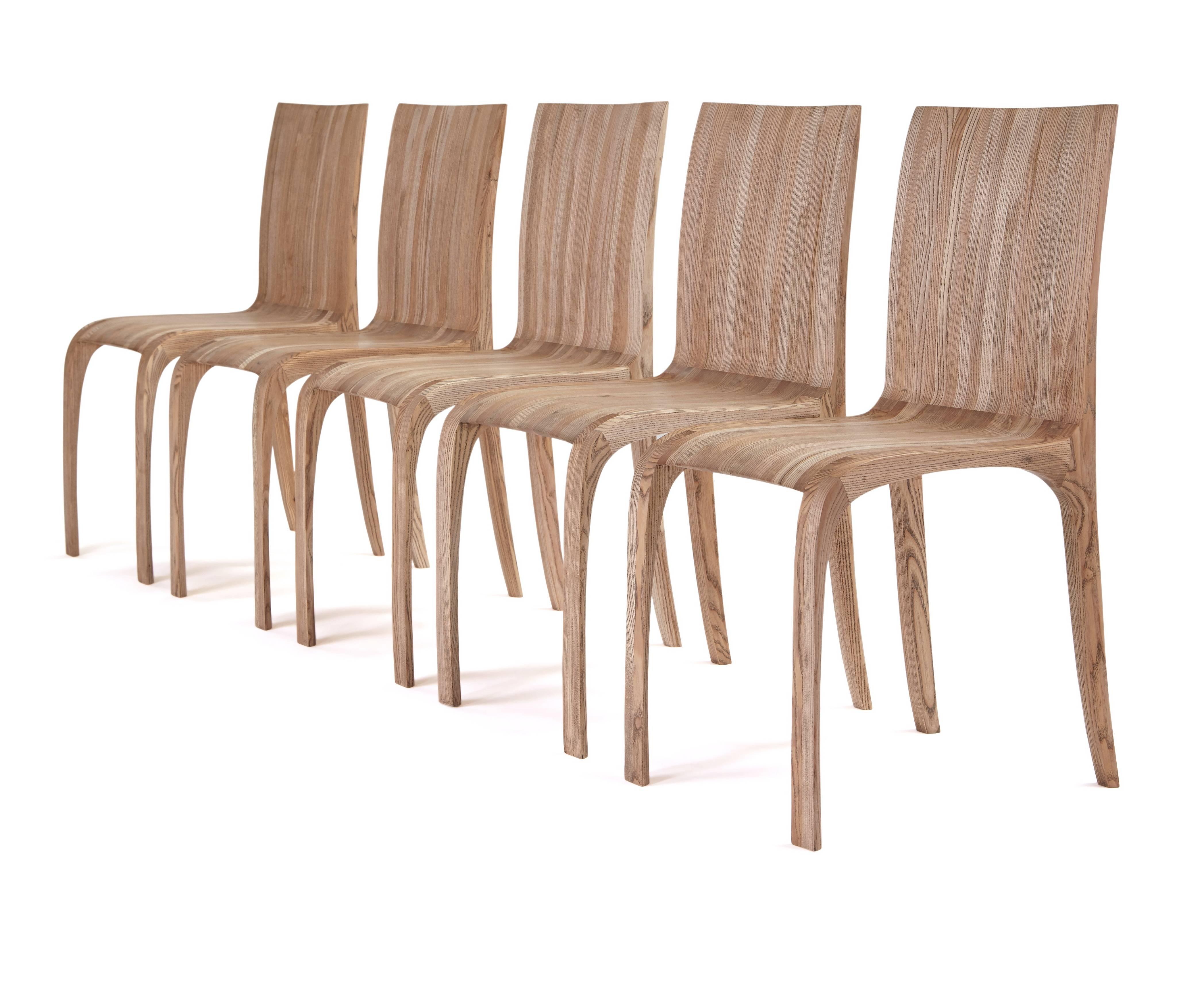 Ash Award winning rippled, ash hand-carved chairs. by Jonathan Field