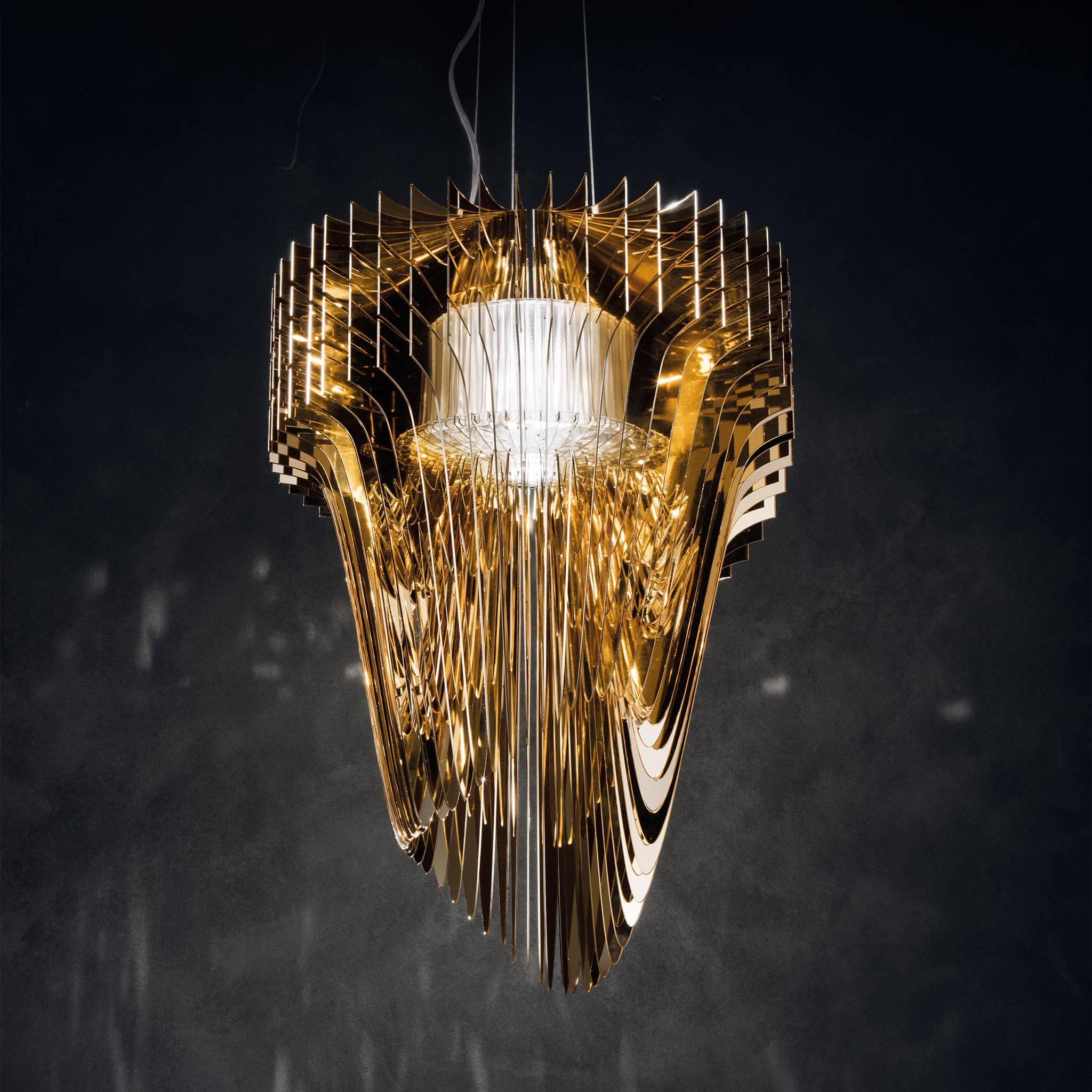 Designed by the late Zaha Hadid for Slamp, the small 'Aria Gold' consists of 50 arms each diverse from the others, radiating around a voluminous LED source. This suspension light has a complex yet fluid contemporary quality and will inject