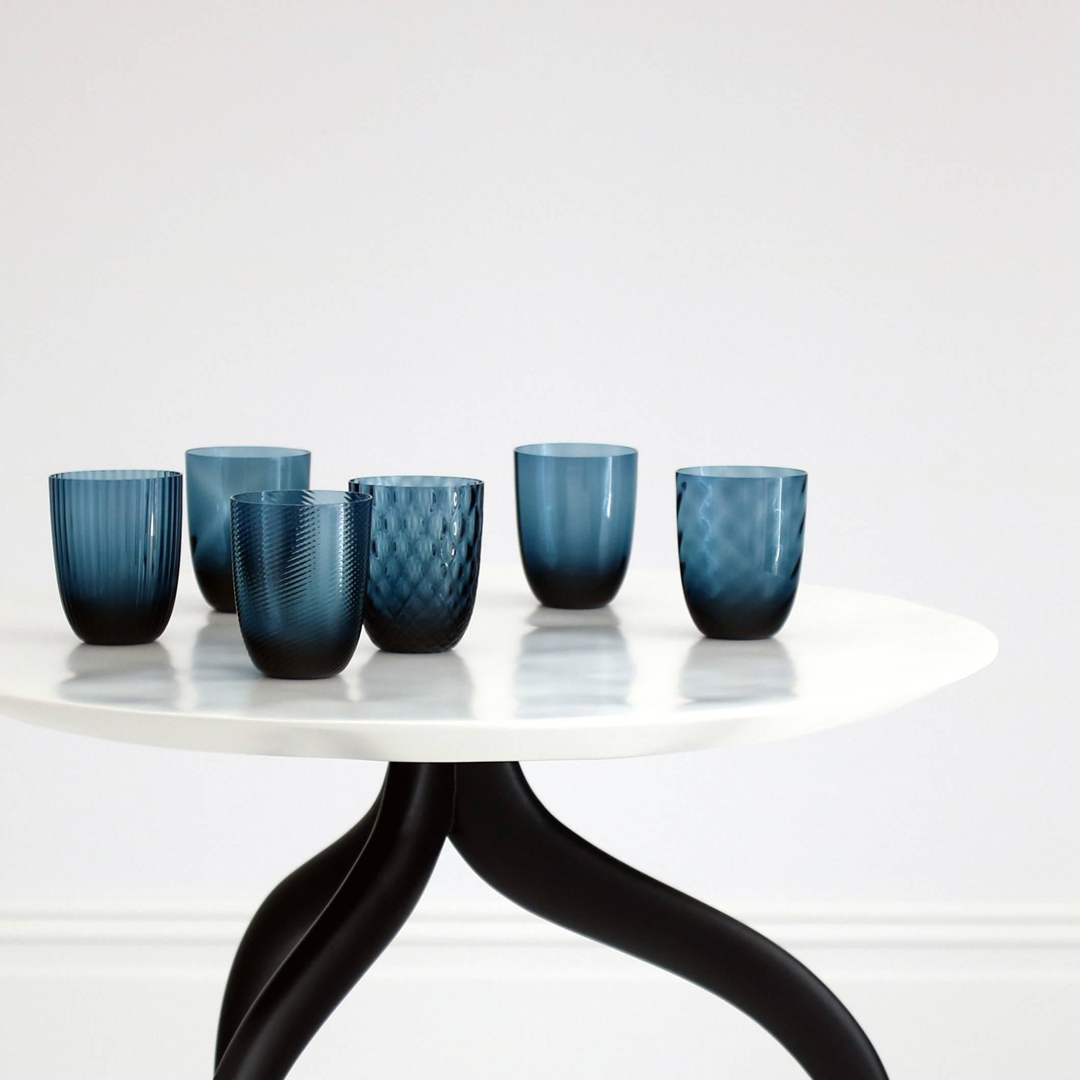 A large sea table with shell top by Giovanna Ticciati. The side table has an undulating top with a chamfered edge giving the impression of a delicate, thin surface, the ripples are carefully designed so that a glass or lamp can be placed on the