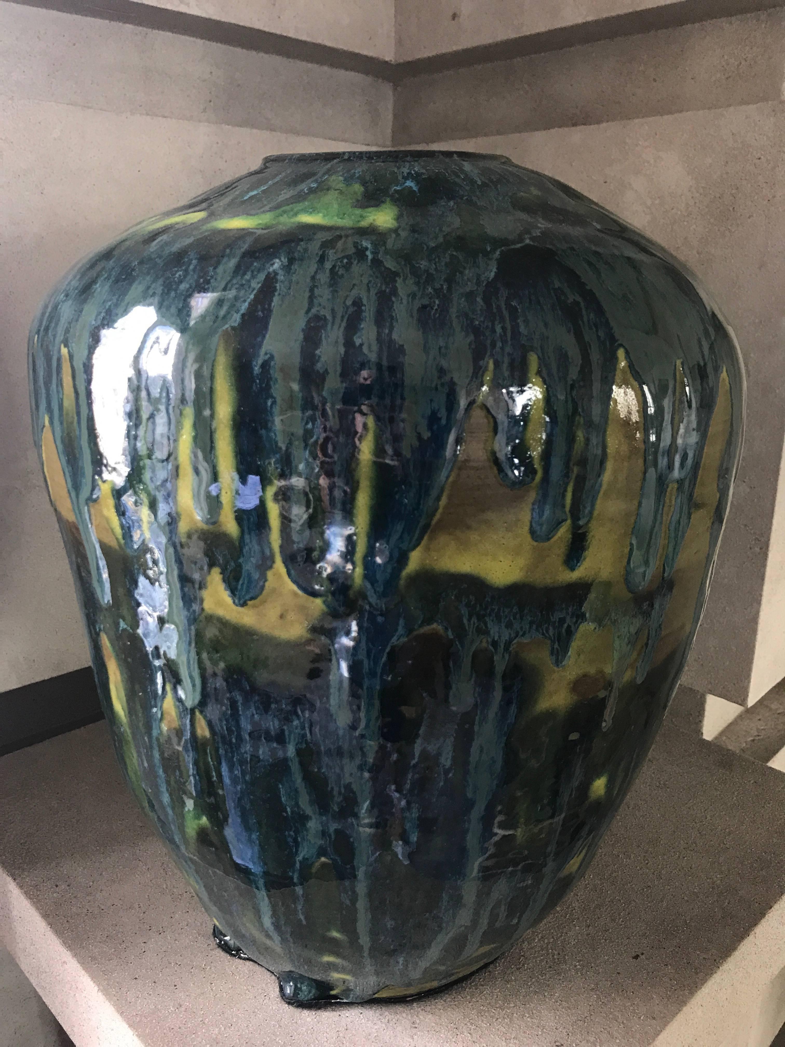 A large-scale, handmade, ovoid shaped ceramic vase in a custom glaze with turquoise and medium blues, moss green, and chartreuse. 
This contemporary vase has been custom designed and makes a sensational statement piece. 

 