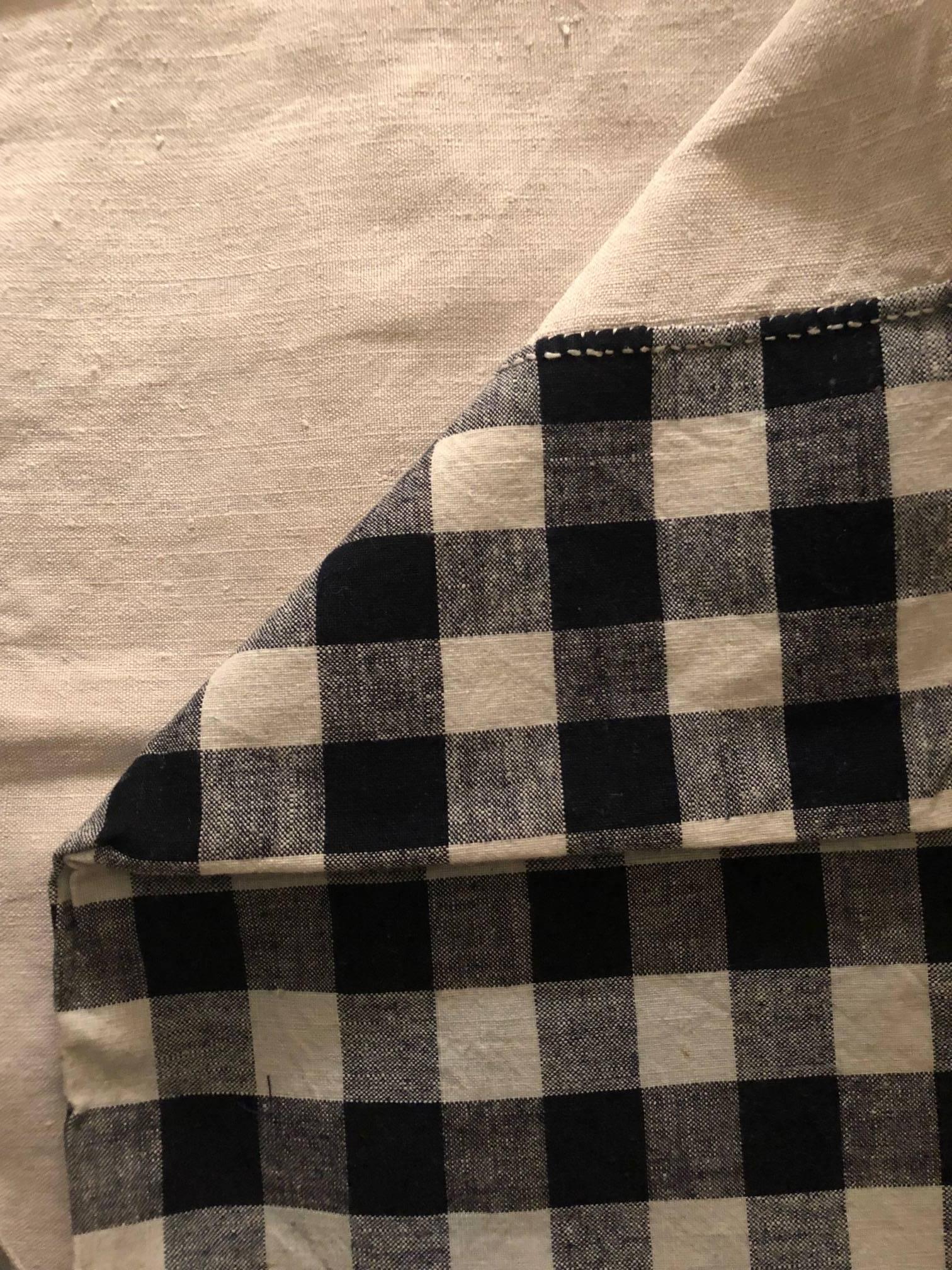 A late 19th century French home spun, handwoven, black and white check antique linen textile, fabric, remnant.
Backed in a natural white antique linen.