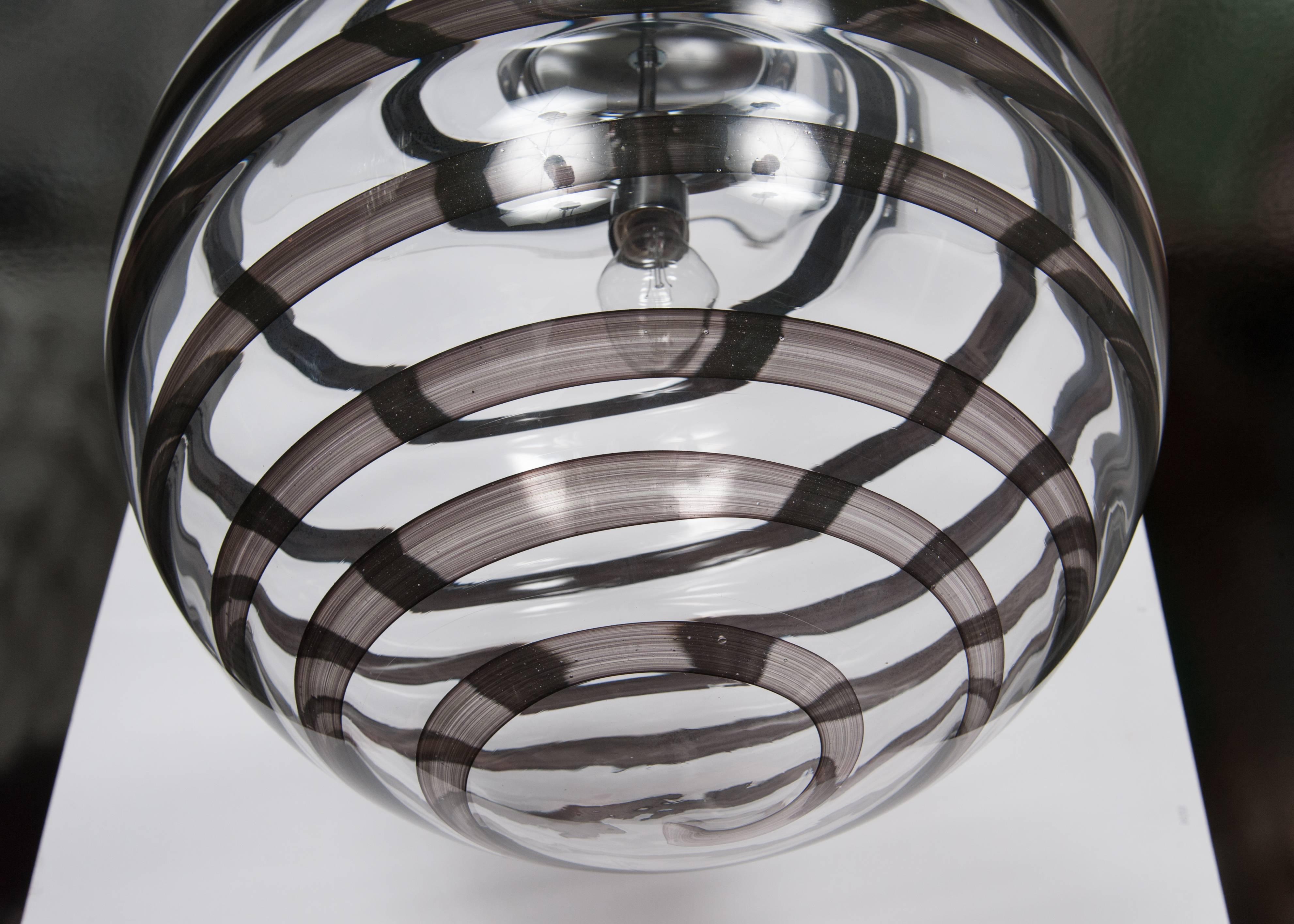 swirling glass globe pendant light