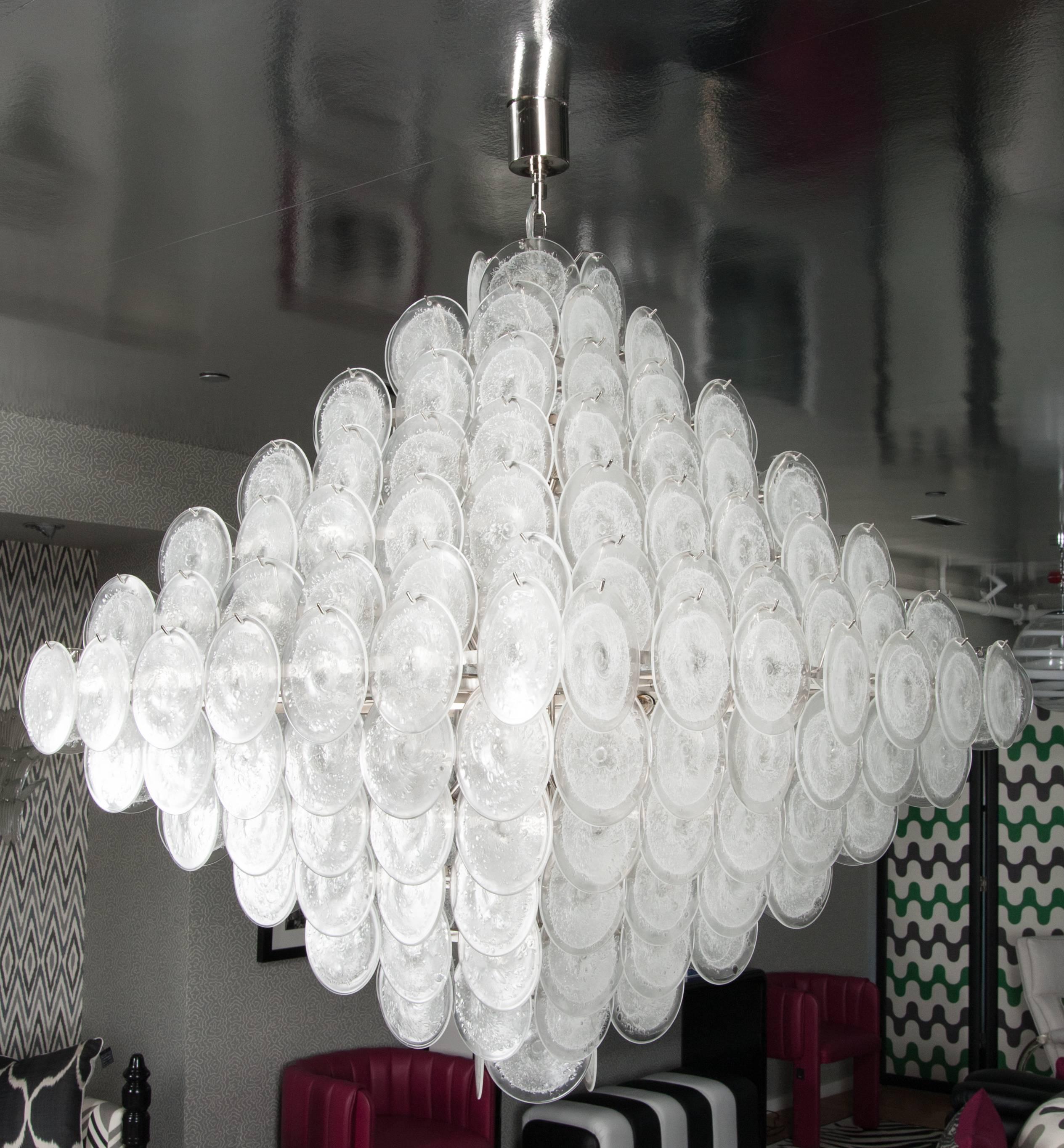 Martyn Lawrence Bullard's pyramid glass disc chandelier with nickel frame.