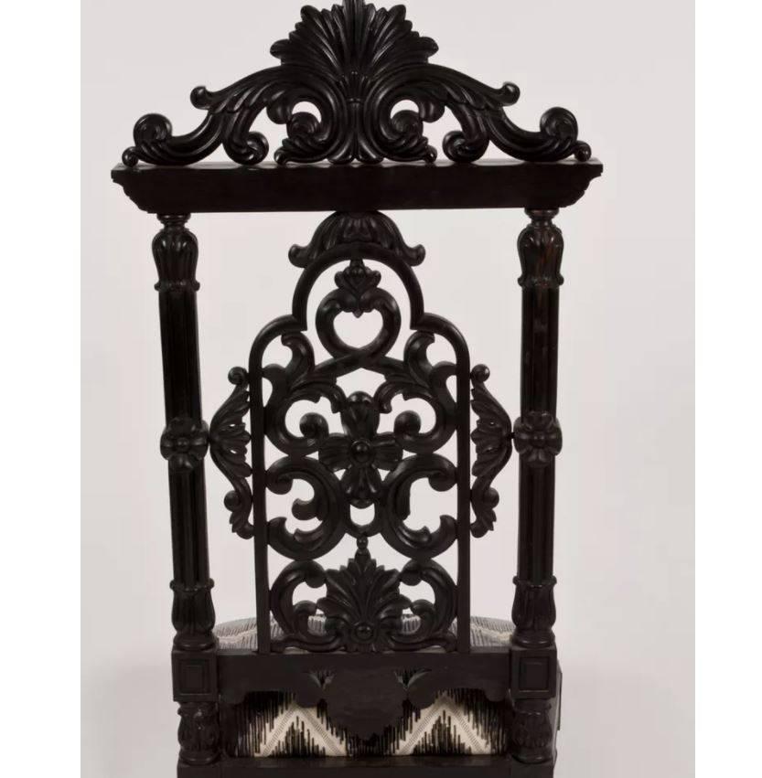 Martyn Lawrence Bullard's custom Alexandria chair.
This ebonized side chair has wonderful decorative carvings inspired by an Anglo-Indian chair presented to Queen Alexandria.