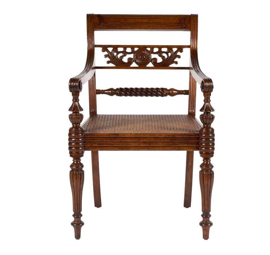 Martyn Lawrence Bullard's custom Colony chair.
These types of chairs were used throughout Colonial India in the 19th century and have great presence today with finely carved back details and carved seats. They are available with and without arms.