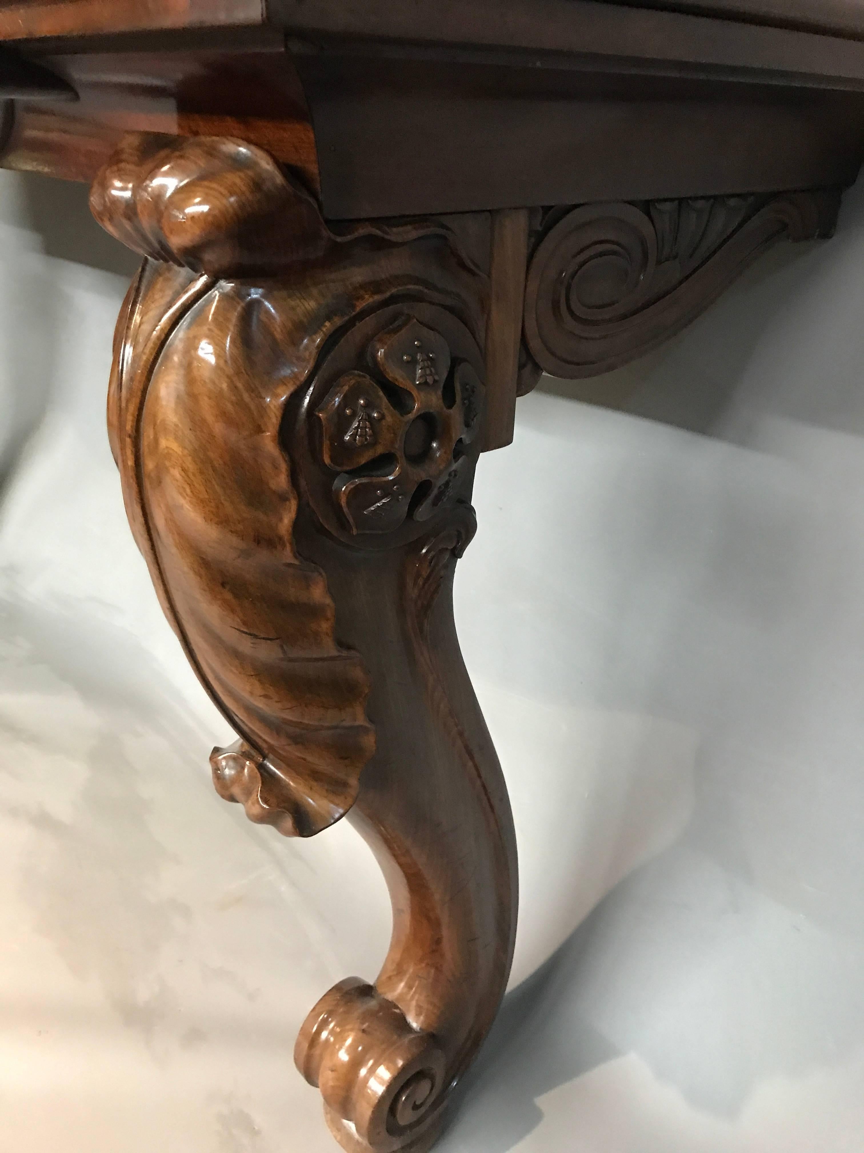 With classical shaped apron and heavy acanthus carved, raised cabriole legs with feet.