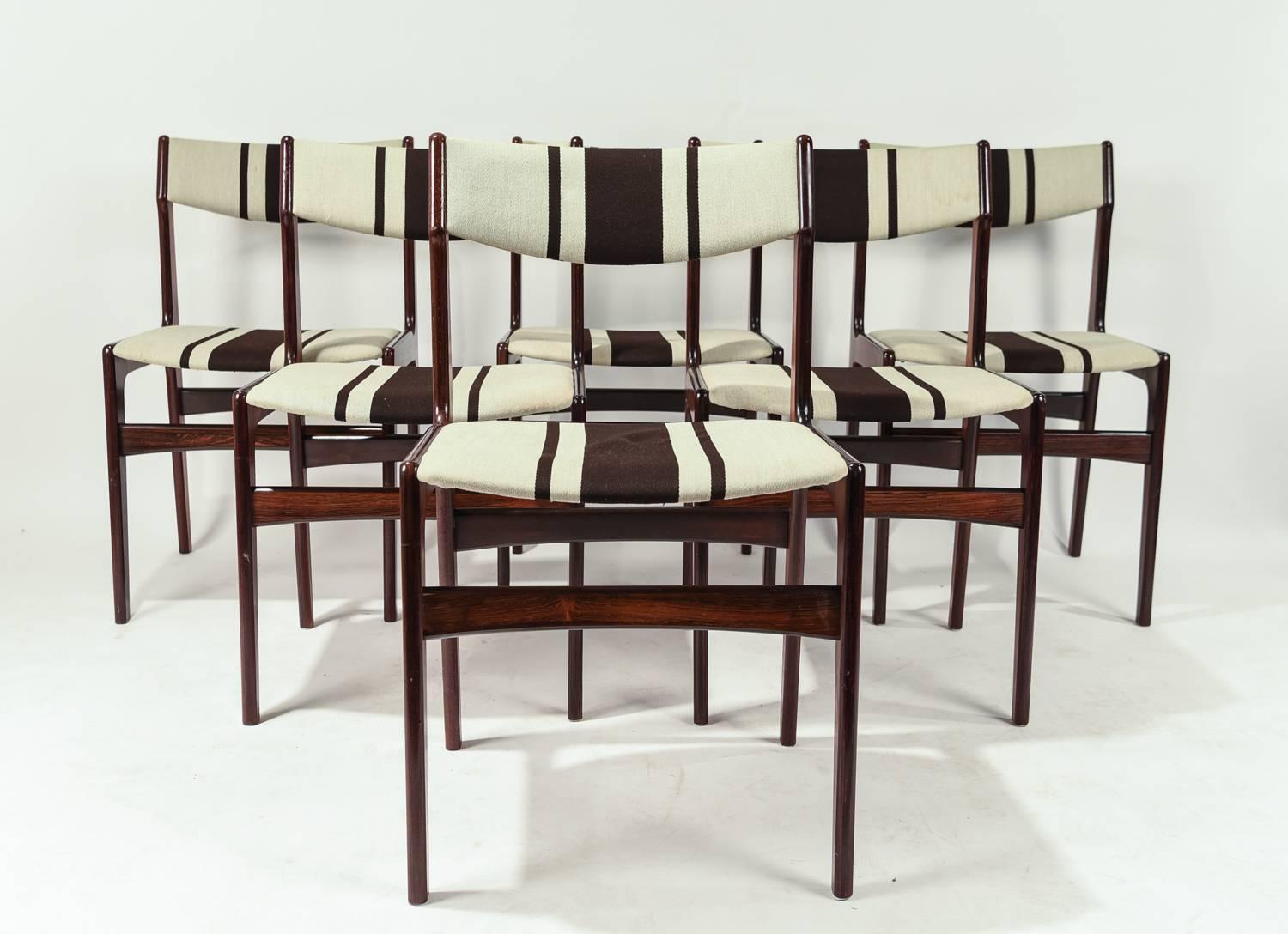 Set of six rosewood side or dining chairs in the manner of Danish Mid-Century designer Erik Buch. Wonderful form and upholstery.