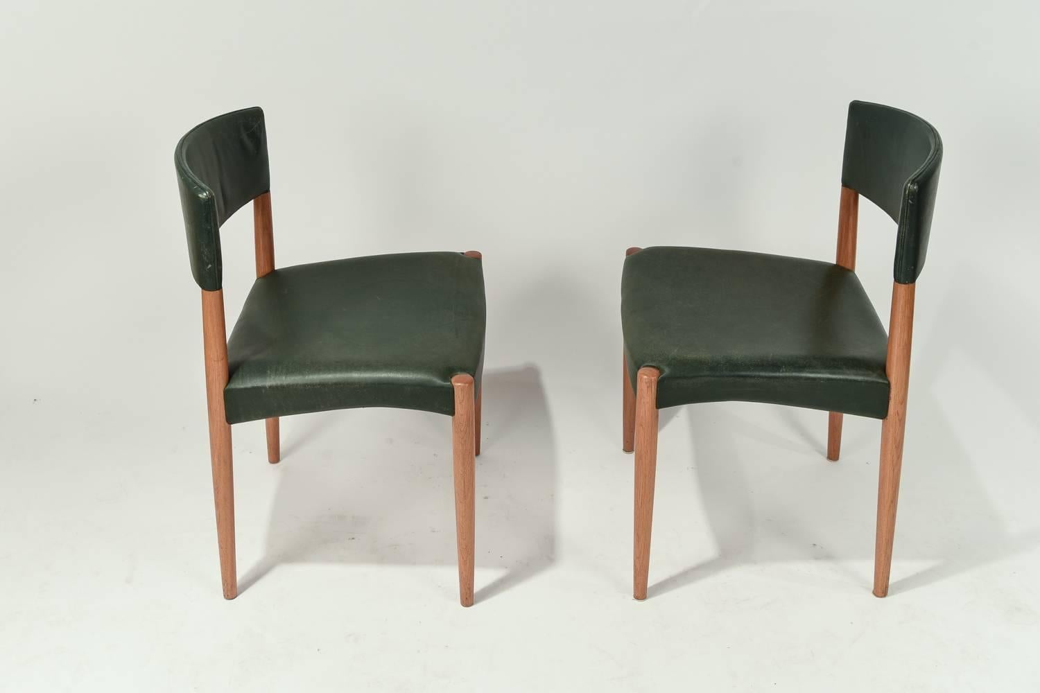 A wonderful set of eight side or dining chairs in leather and oak by Ludvig Pontoppidan.