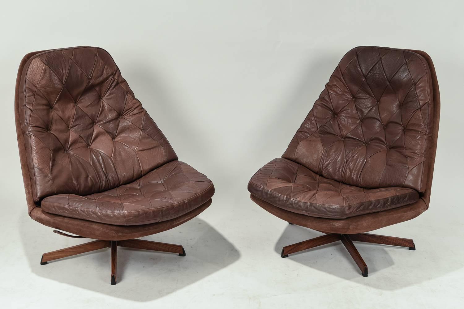 This pair of Model MS68 swivel high back chairs was designed by Madsen and Schubel. Upholstered in supple leather.