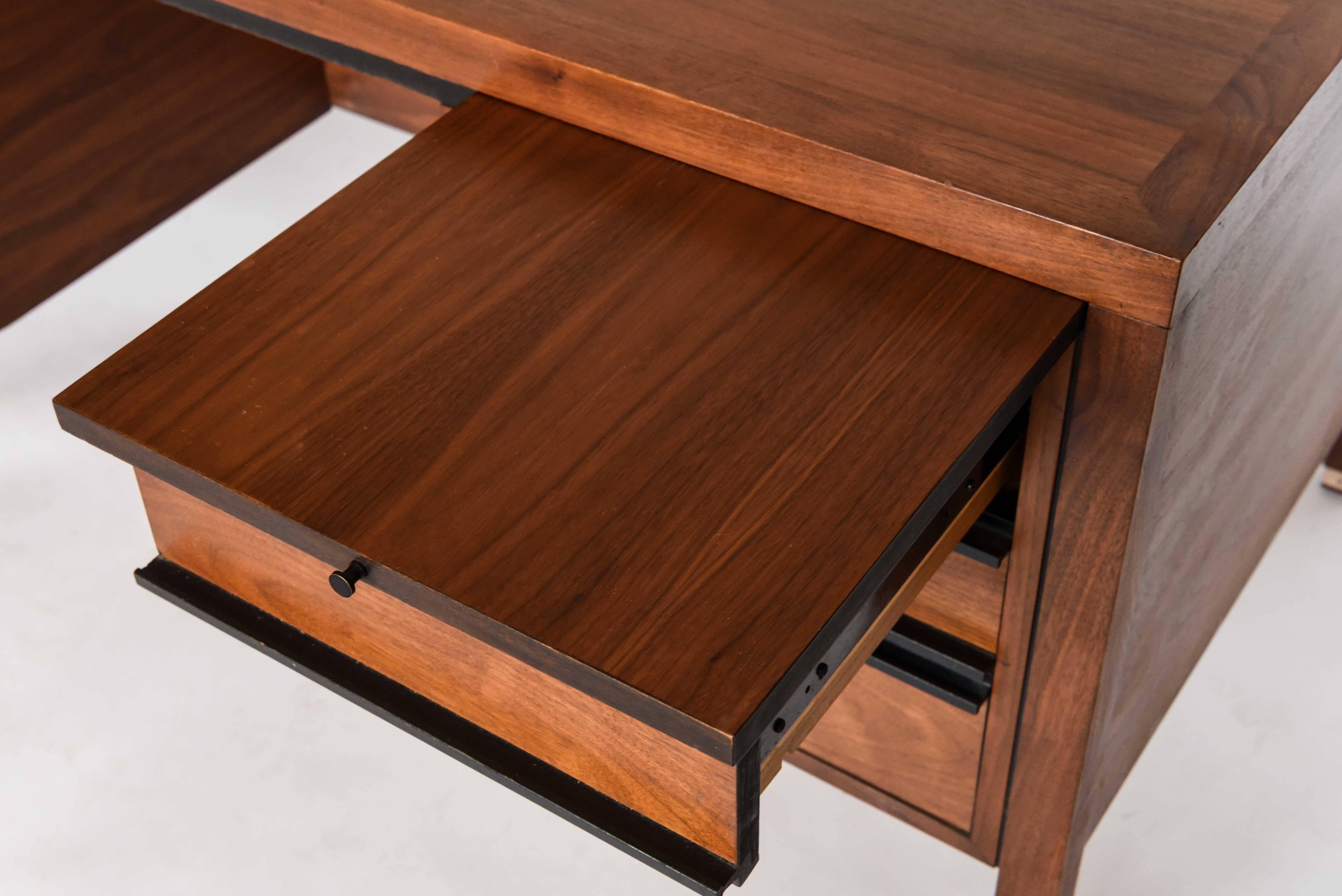 This sleek midcentury desk was produced by Directional for Calvin Furniture Co. and is frequently attributed to Paul McCobb along with more pieces of this set.
Tagged inside left hand drawer: Directional, Calvin Furniture Co. Grand Rapids Michigan.