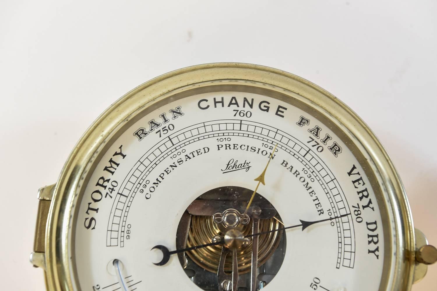 A beautiful ships clock and barometer weather station made by Schatz, the model is the Royal Mariner. The clock mechanism has been changed to battery power so no need to wind anymore, and the barometer indicates the accurate pressure.