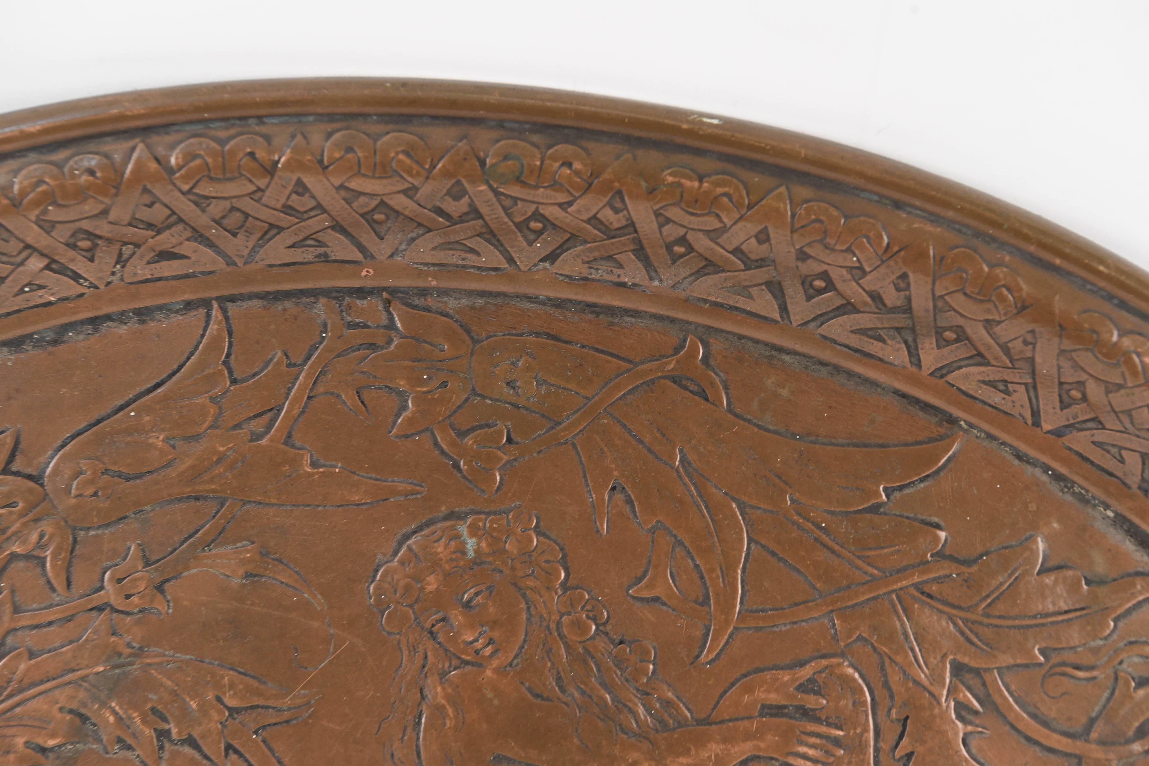 A beautiful aesthetic style copper tray with alligator and female nude dating to the 1870s.