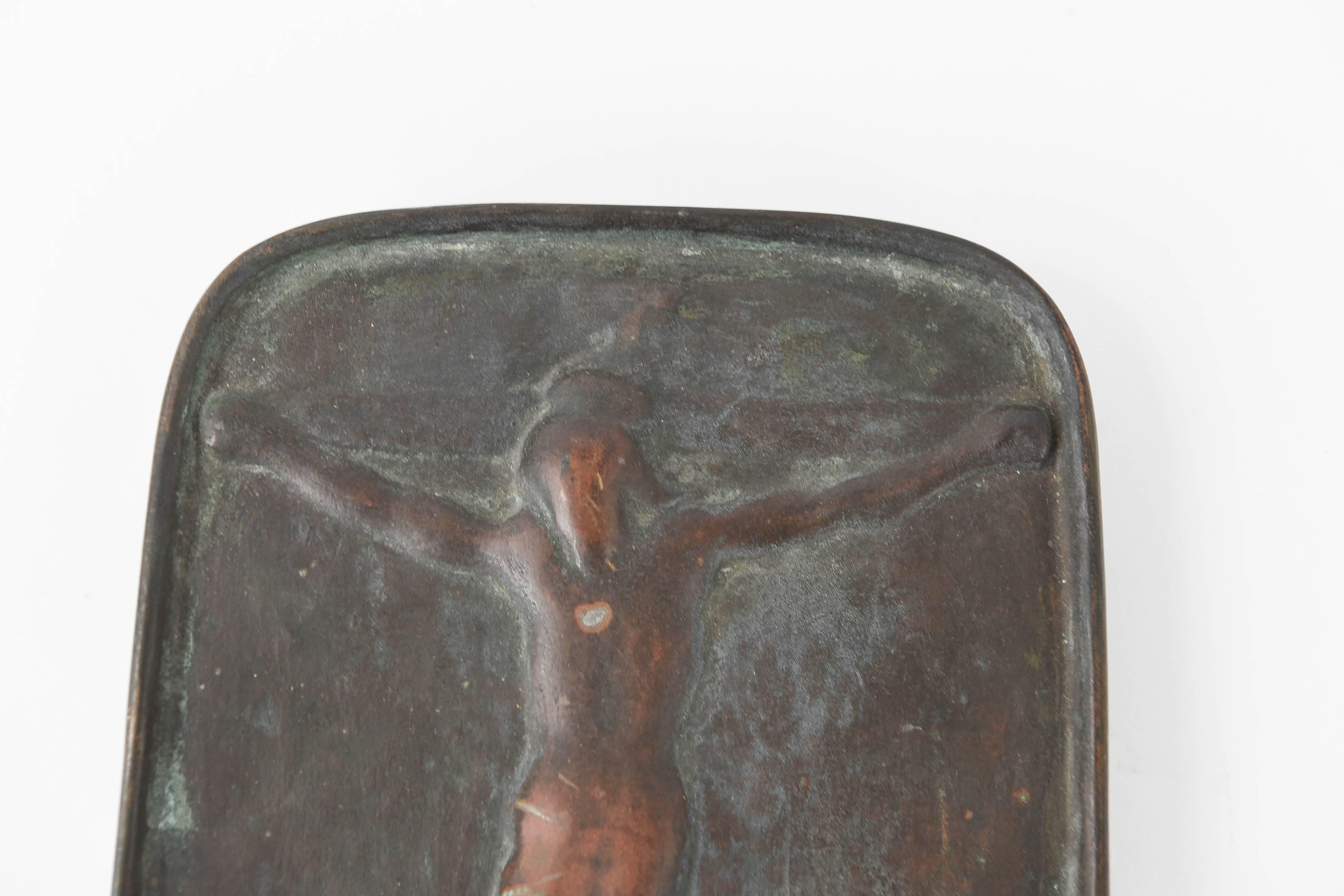 This 20th century Japanese Fumi-E bronze plaque is depicting the crucifixion of Jesus. The use of fumi-e began with the persecution of Christians in Nagasaki in 1629. Their use was officially abandoned when ports opened to foreigners on April 13,