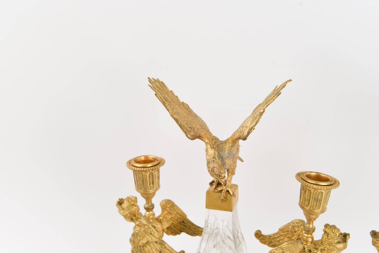 A beautiful pair of French rock crystal candelabra from the mid-19th century. These are beauties with the best quality in bronze and ormolu work to the sculptural eagles. Very fine appearance with a stunning gilt finish.