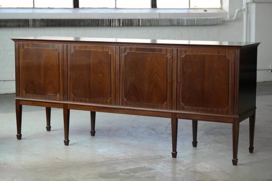 Beautiful low sideboard in mahogany designed in English Hepplewhite style by Frits Henningsen early 1960s in Denmark. Overall great vintage condition with some small scuffs and wear namely to the rear edges of the piece (see picture).