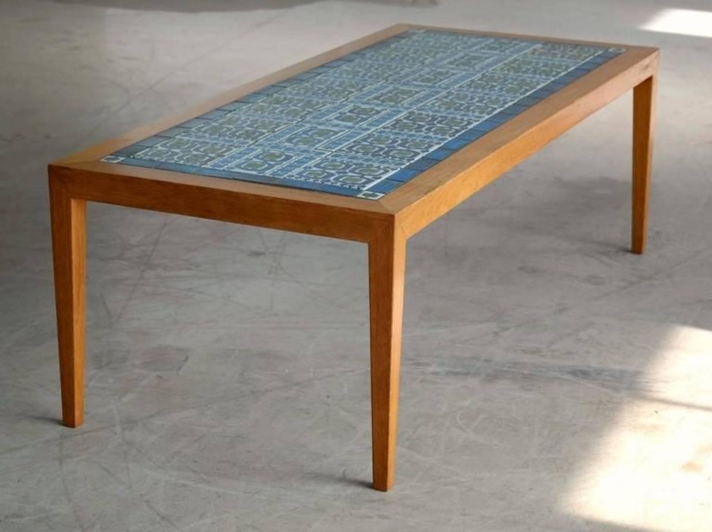 Beautiful teak coffee table by Severin Hansen Jr. for Haslev with inlaid tiles designed by Grethe Hellan Hansen and manufactured by Royal Copenhagen. Haslev's coffee tables epitomizes Minimalist elegance with it's sharp lines and iconic diamond