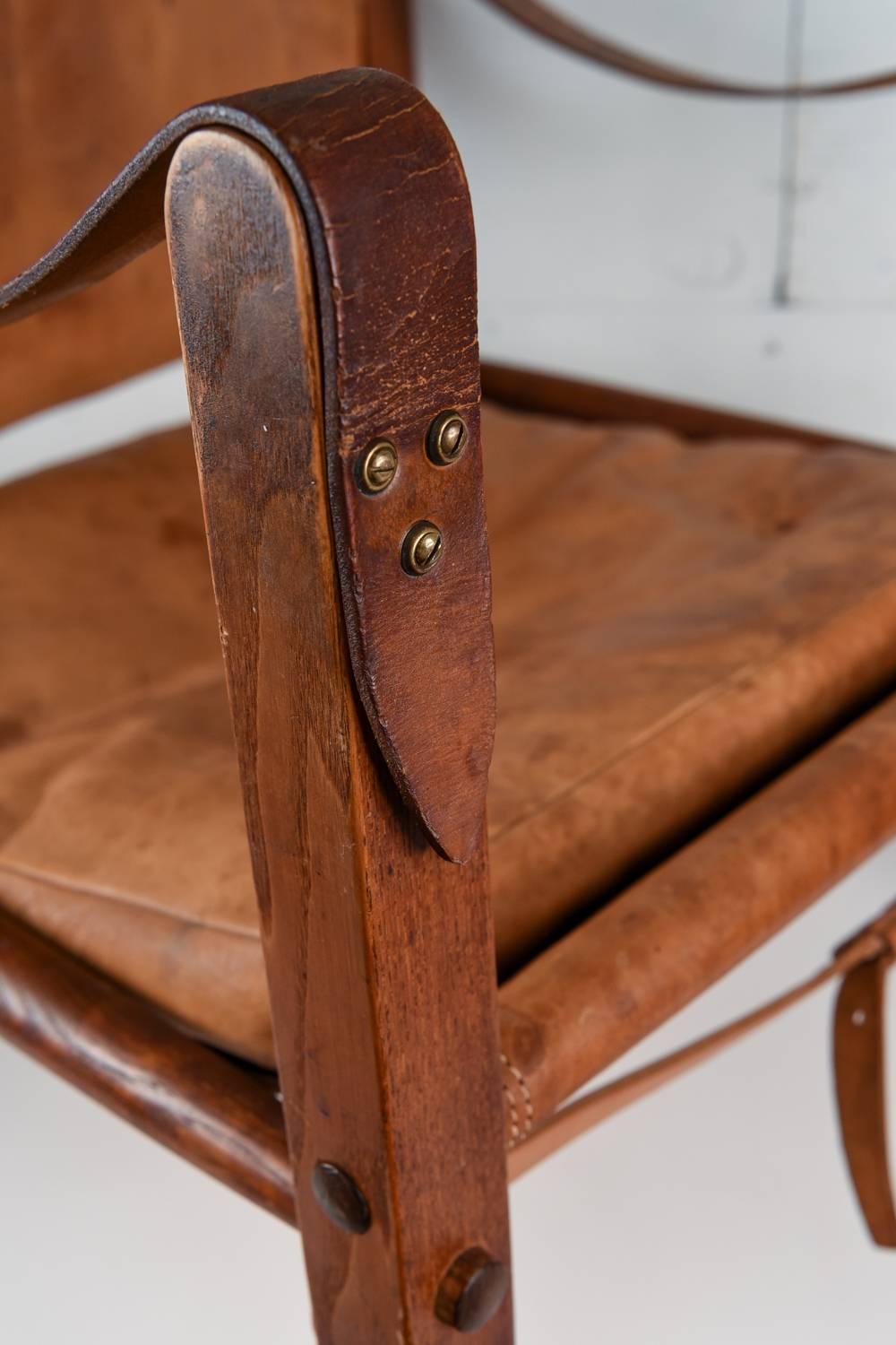 A great chair with a lot of patina, vintage broken in leather, could use a conditioning, but shows its age with character .