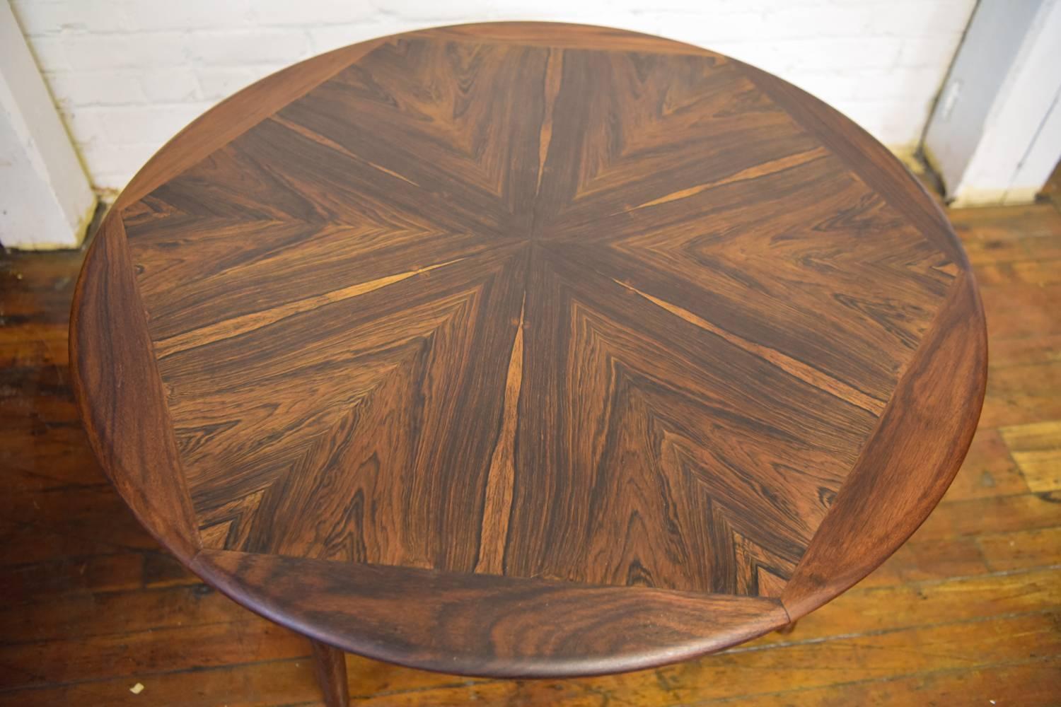 This coffee table features a stunning rosewood top, creating a beautiful pattern.