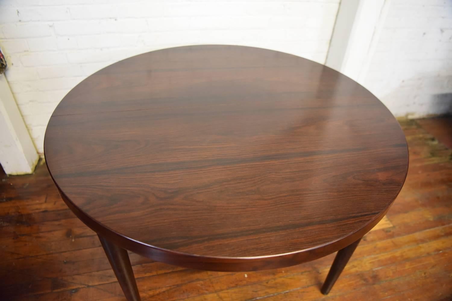 A beautiful Danish Mid-Century rosewood dining table designed by Kai Kristiansen for Skovmand & Andersen in the 1960s.