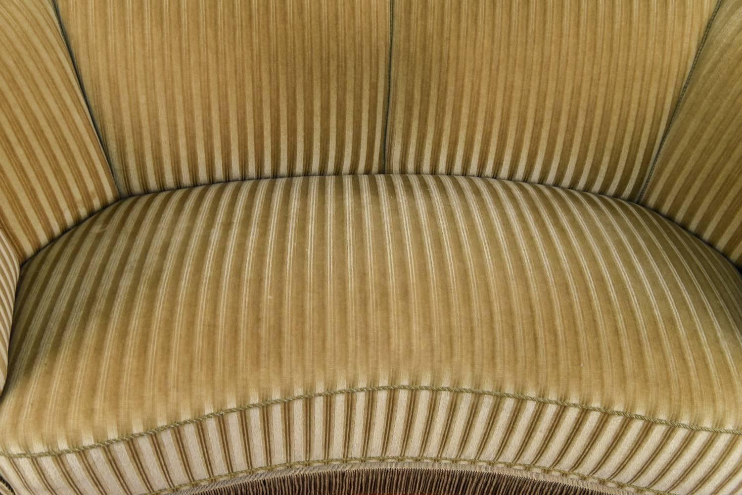 A classic banana form loveseat by Slagelse, circa 1940s. Upholstered in stunning velvet.