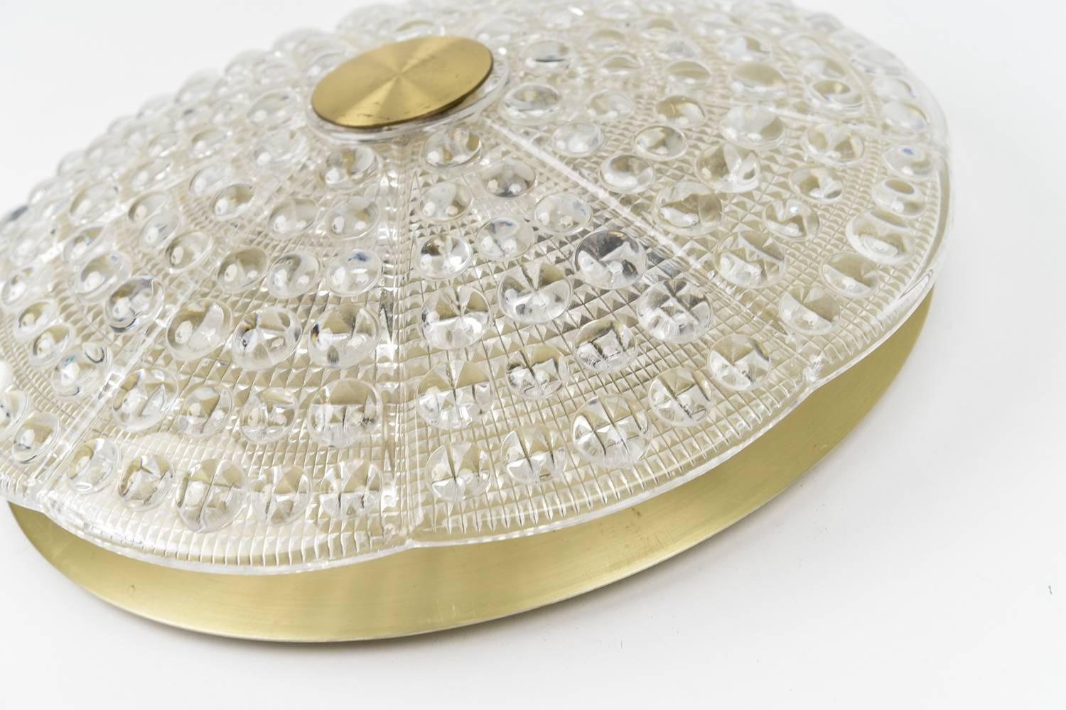 Orrefors textured crystal in round and diamond design with gilded brass backplate and round brass top cap. Designed by Carl Fagerlund, circa 1960s.