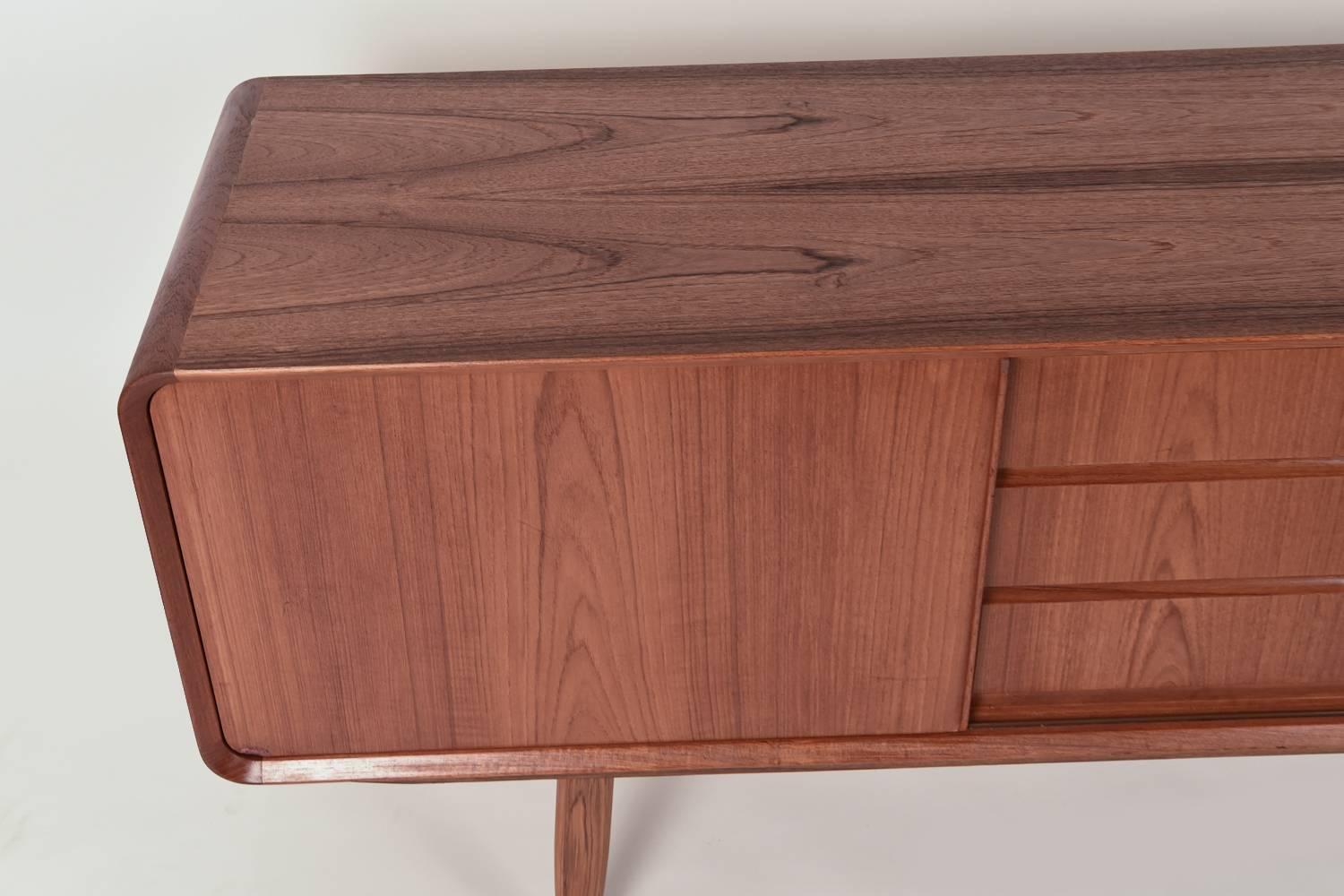 This Danish Mid-Century sideboard by Nexo is made of handsome teak wood. Wonderful modern design with a Classic look.