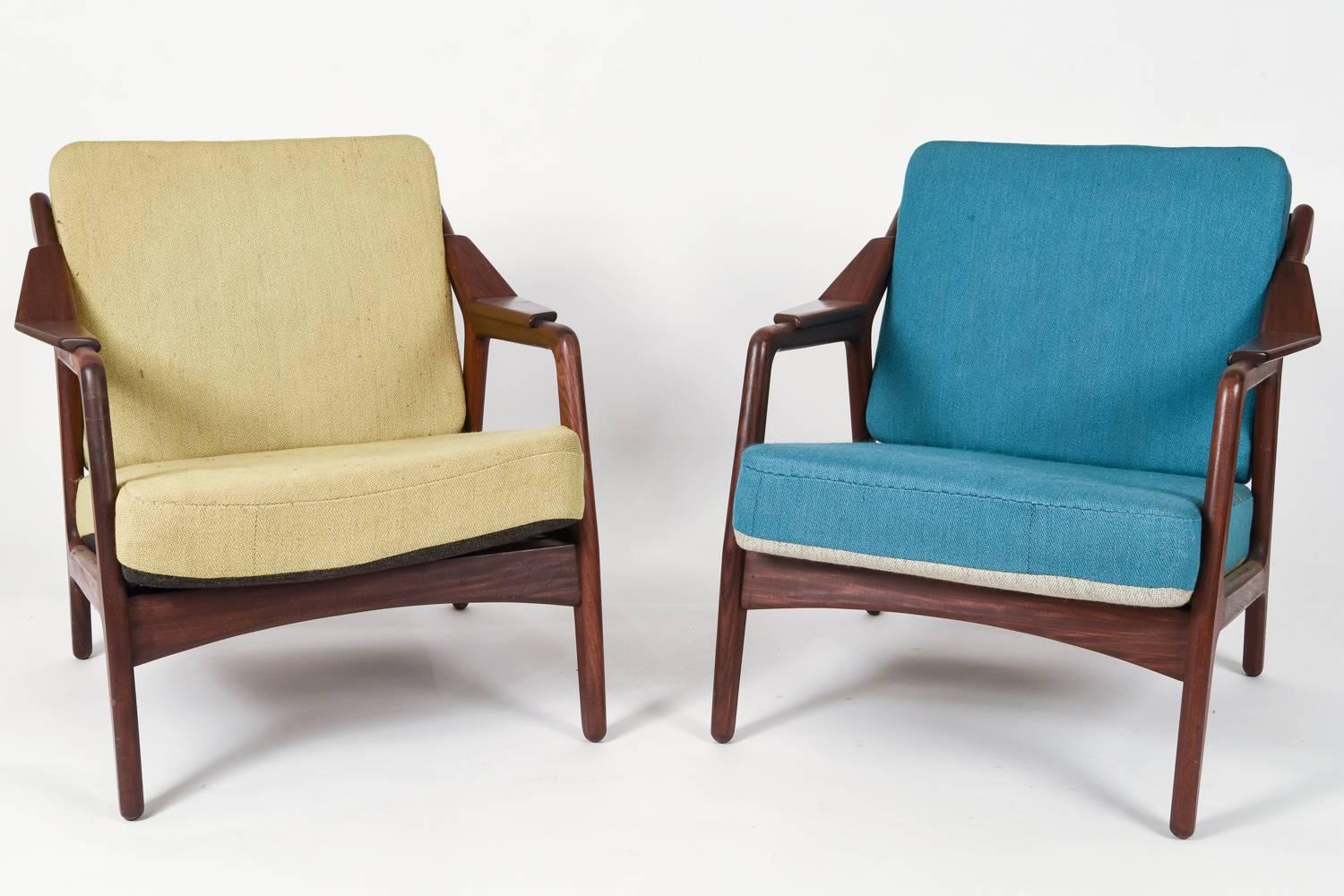 A great pair of Danish Mid-Century easy chairs designed by H. Brockmann Petersen for Poul M. Jessen. Very interesting design and wonderful teak wood, circa 1950s.
