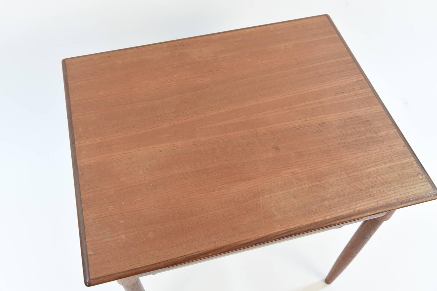 This is a fabulous Norwegian midcentury teak sewing table. Great compartment underneath for storage. Would work wonderfully for apartment living.