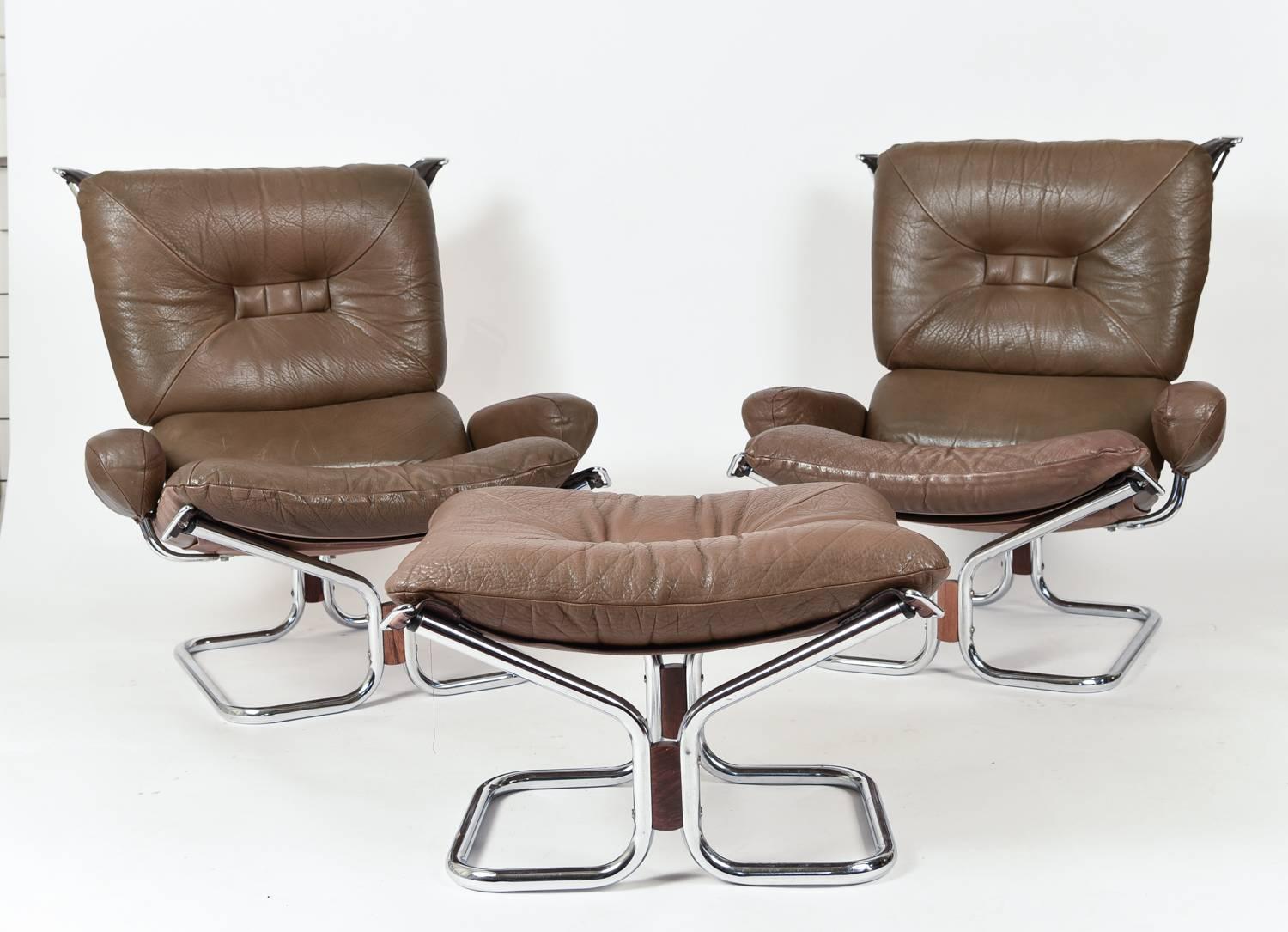 A beautiful and comfortable pair of sling chairs including the hard to find ottoman by Harald Relling. These iconic Danish chairs will be the focal point in any room.