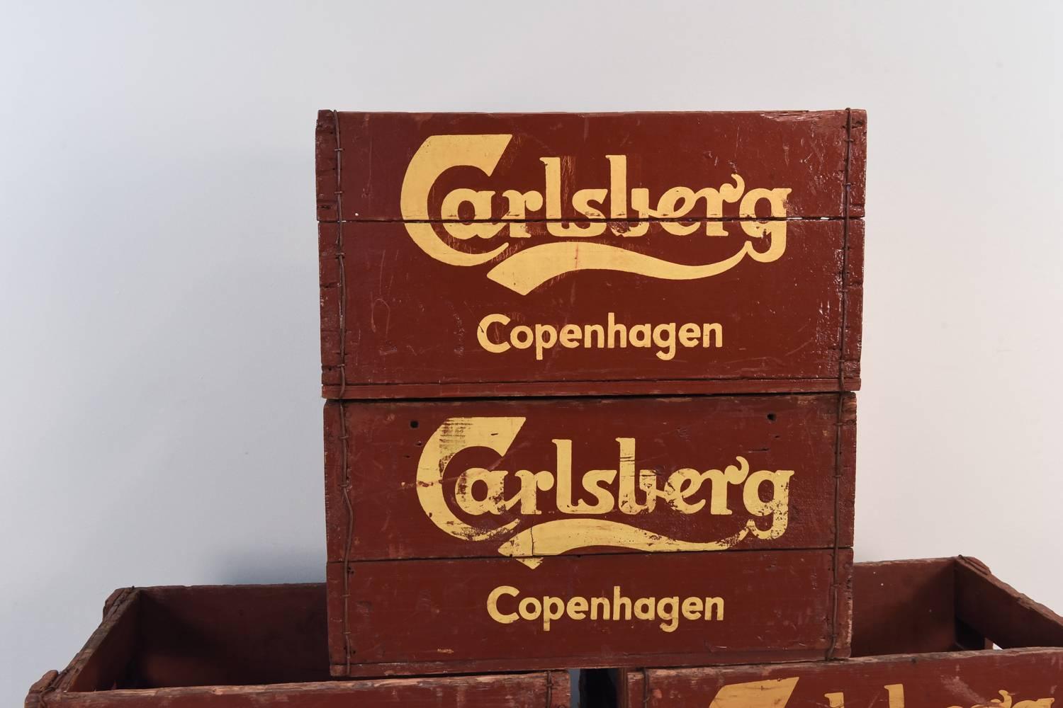 12 vintage Carlsberg beer crates from Copenhagen. Fantastic decorative pieces. Could be used individually or put together to make a coffee table base. Endless possibilities.