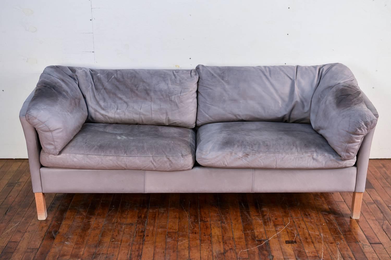 Mogens Hansen Model 35 sofa in gray leather upholstery. Wonderful Danish midcentury design. We have two of these available so you can purchase one single or as a pair.