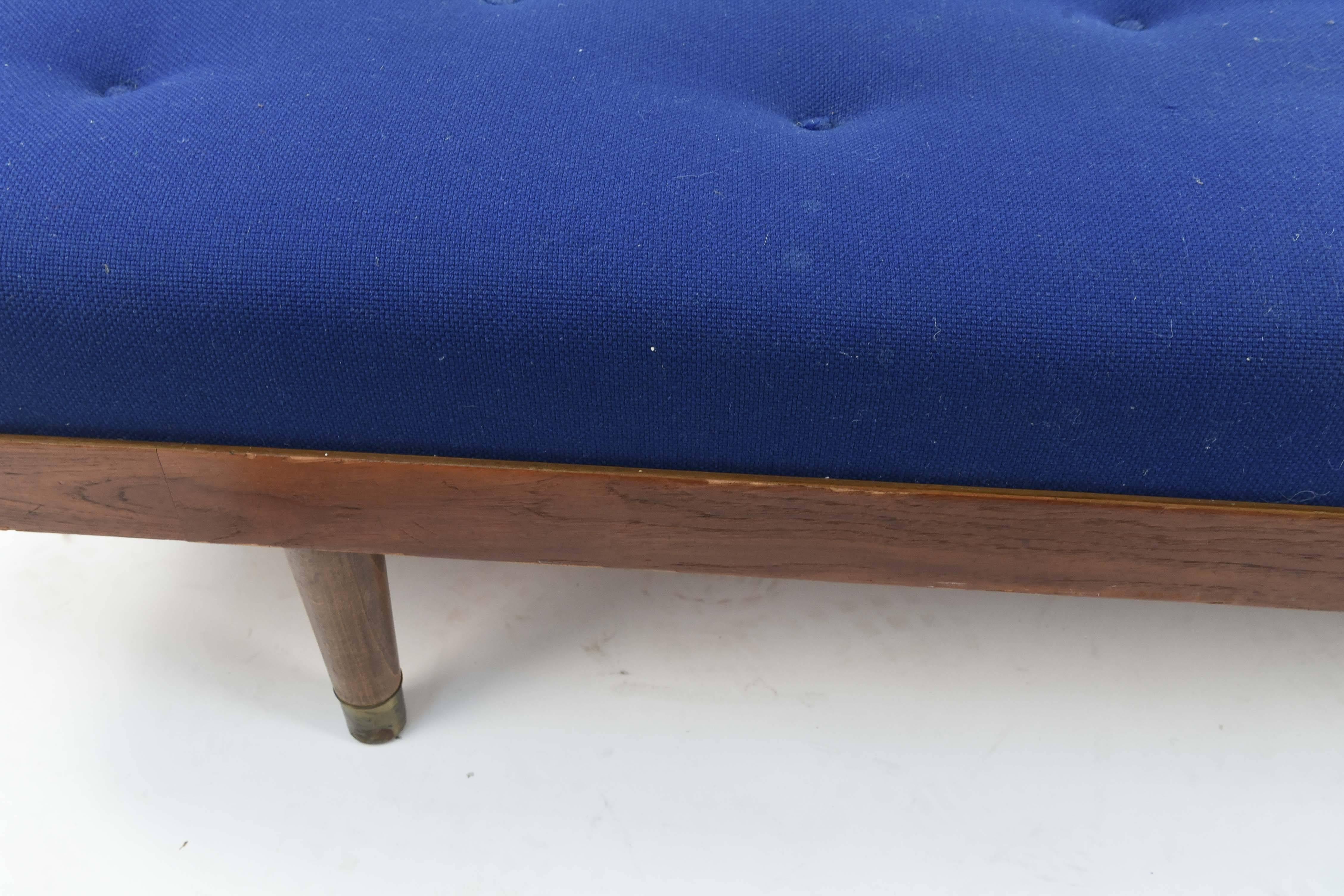 This Danish midcentury daybed features a teak frame and a striking, electric blue upholstered tufted seat cushion. A very eye-catching piece.