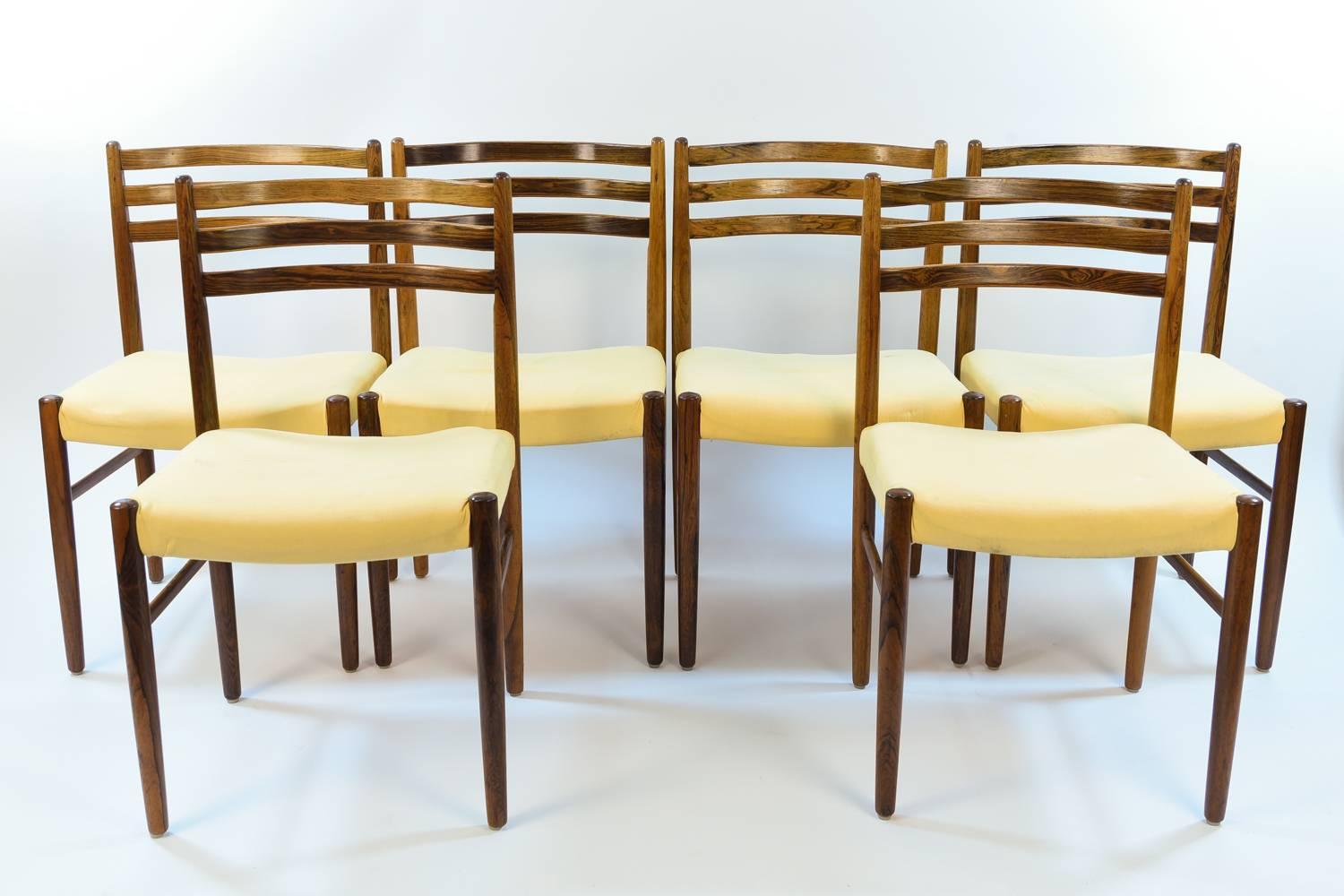 A wonderful set of six Danish midcentury side chairs featuring rosewood frames. Would be a great dining set.