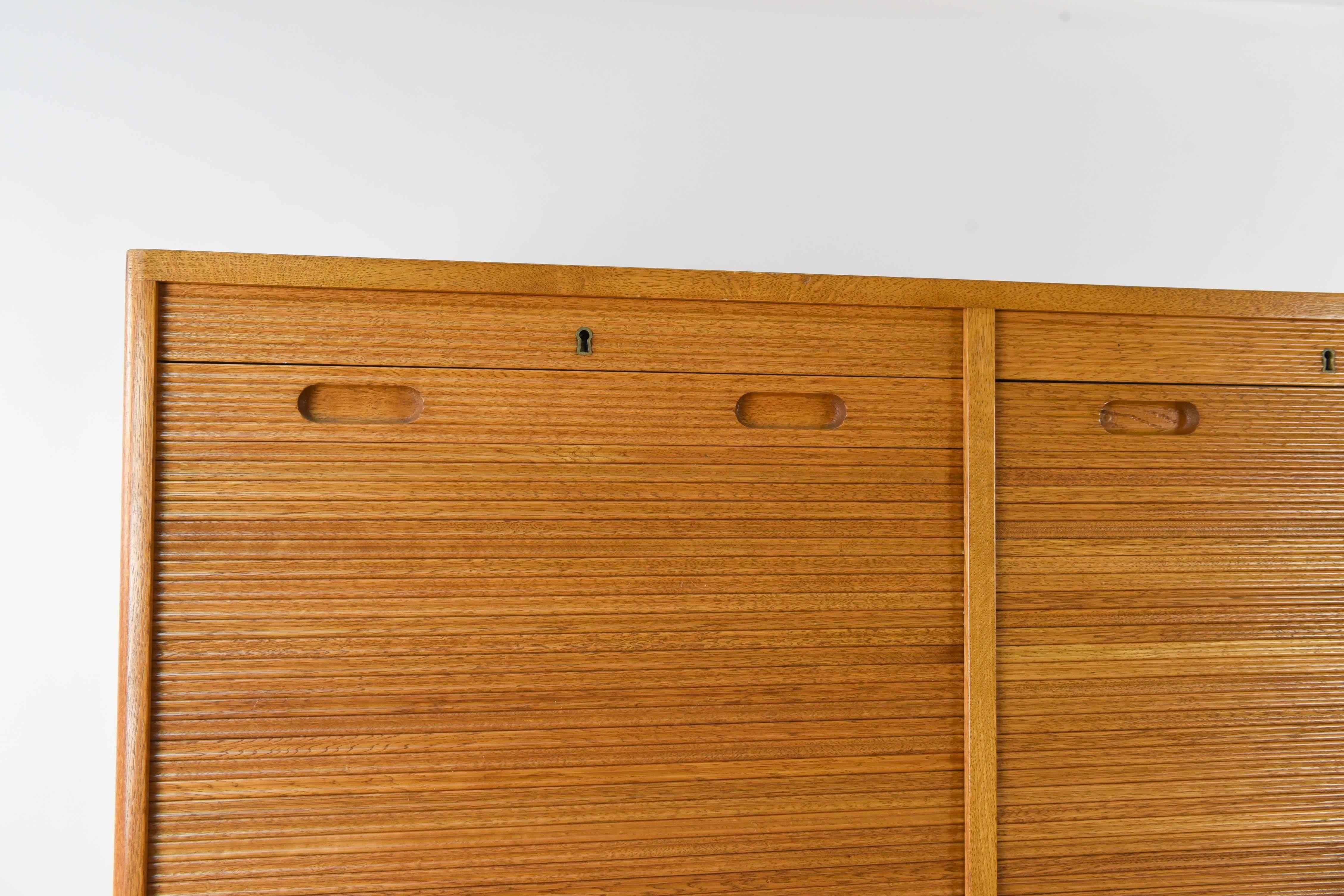 This is a fabulous file cabinet with adjustable file drawer/shelves. The attractive exterior features tambour doors that open to reveal a wonderful file system, that will add style and much-needed organization to any office space!