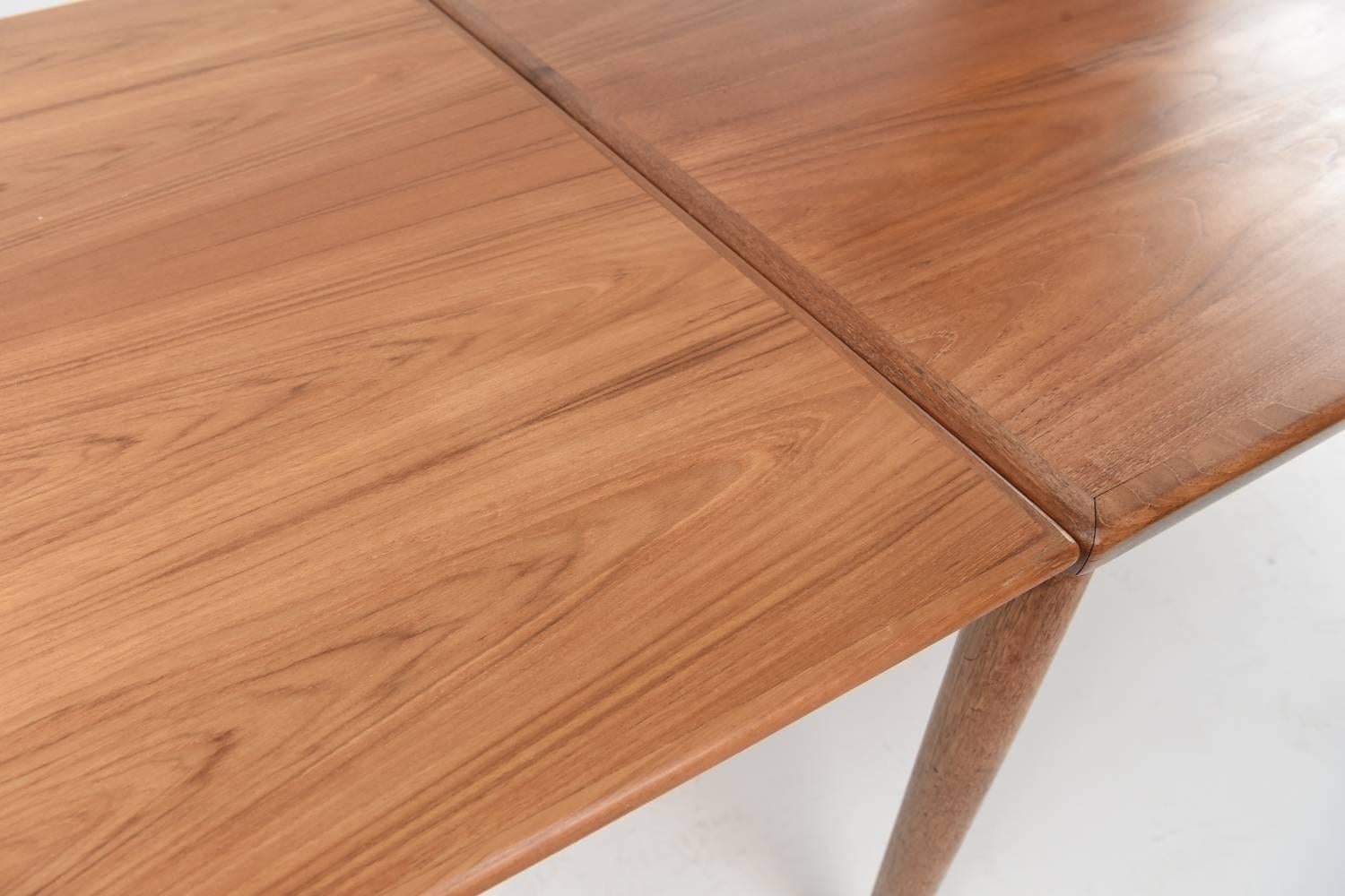 extending teak dining tables