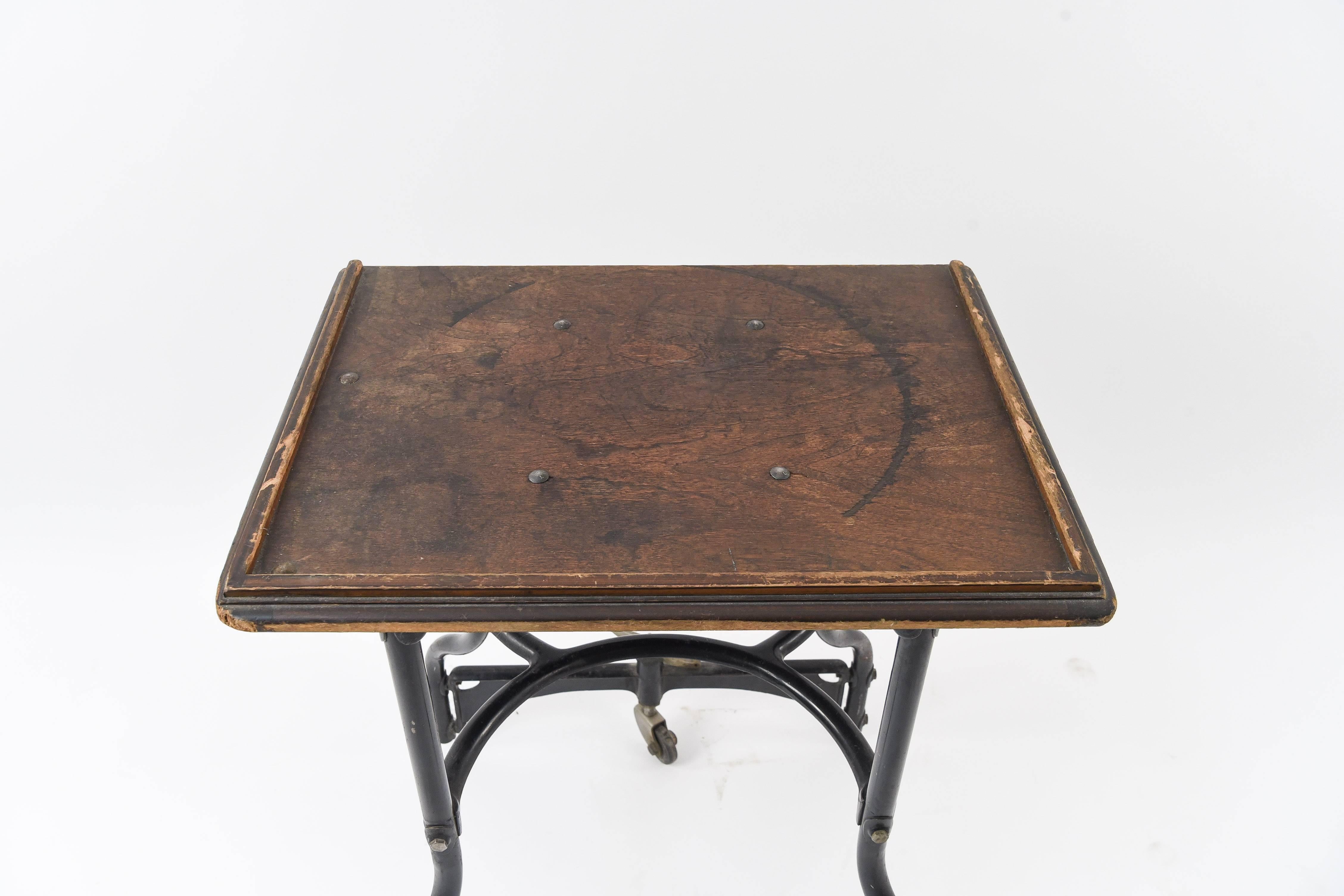 A wonderful vintage Industrial table with metal legs and a wooden top, this would be a great accent piece to any room!