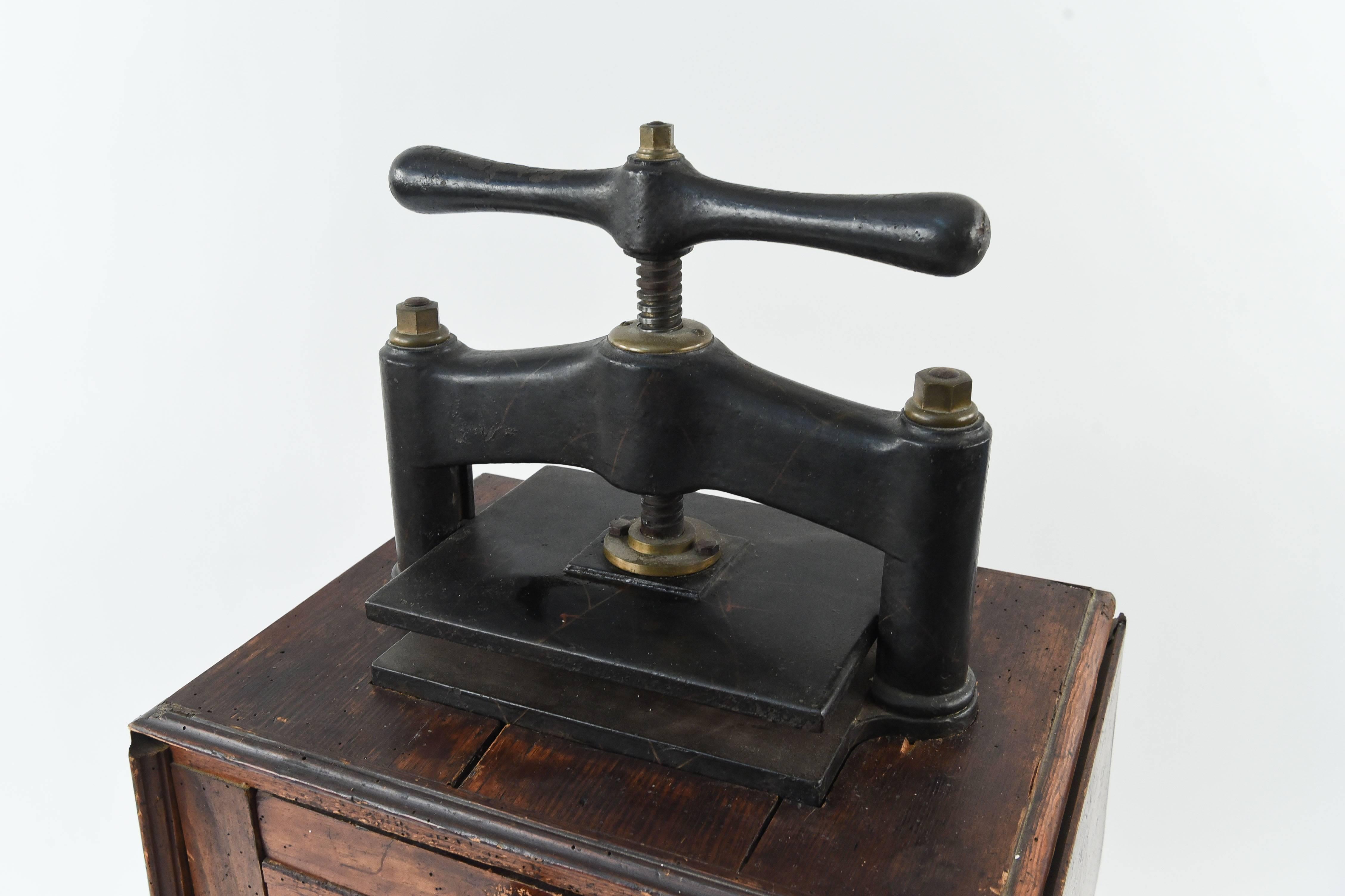A great historical example of a 19th century book press complete with original three-drawer work table base. The base has great patina and very old holes in the wood showing the great age of the piece.