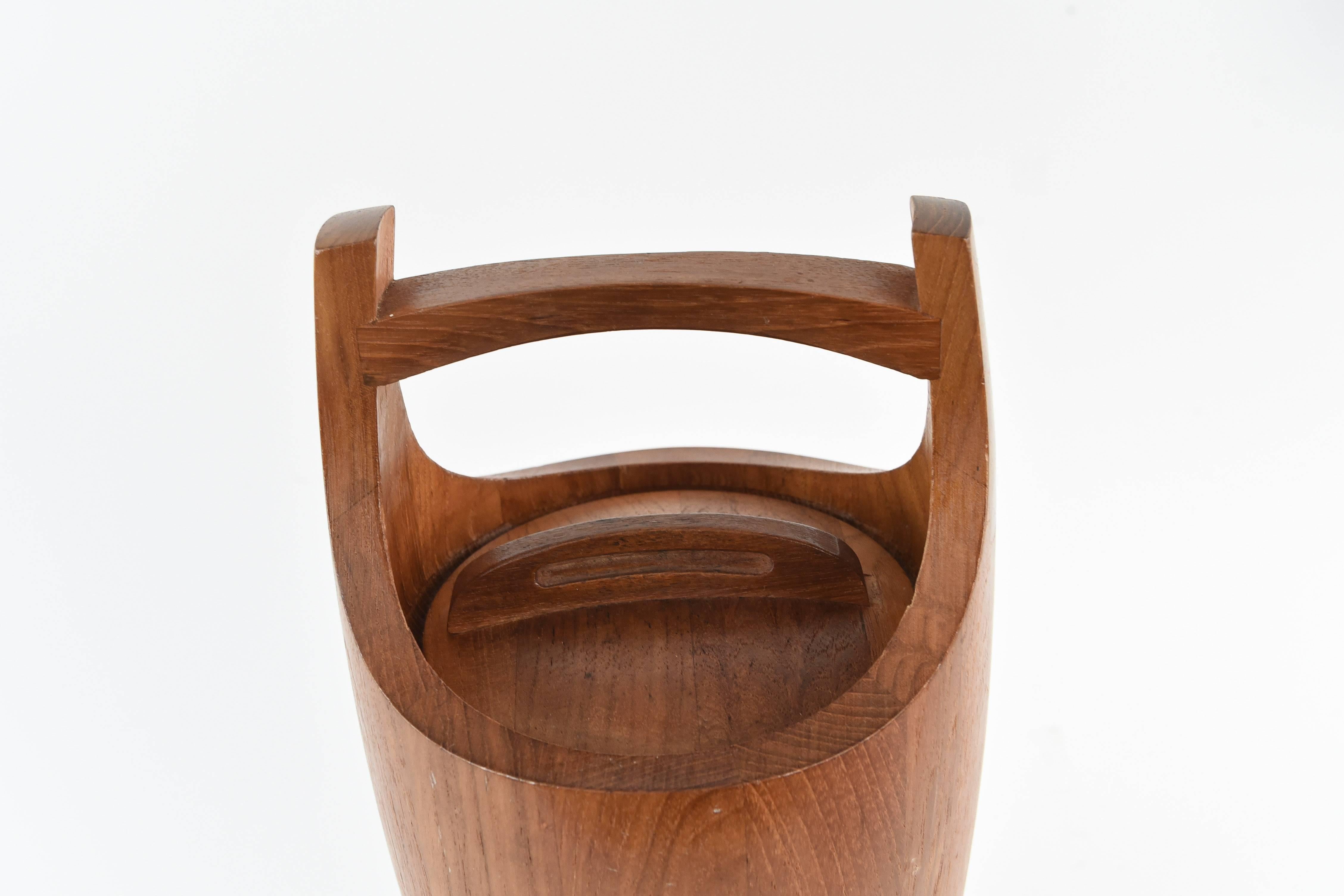 A Danish teak ice bucket, circa 1960s designed by Jens Harald Quistgaard for Dansk Designs. This is one of his more popular designs, with a timeless appeal.
