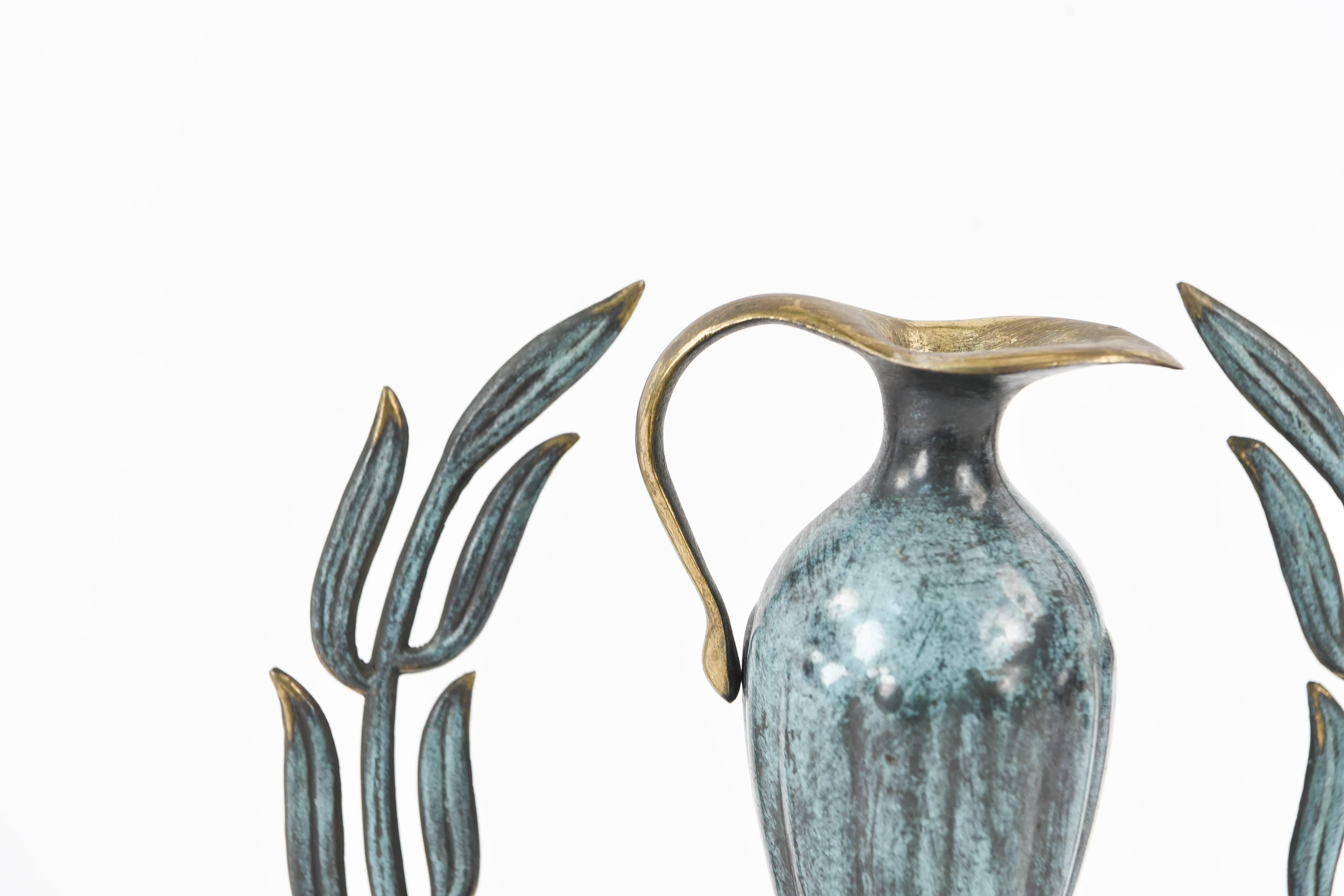 A wonderful modernist menorah with hard to find slave light and oil jug.
